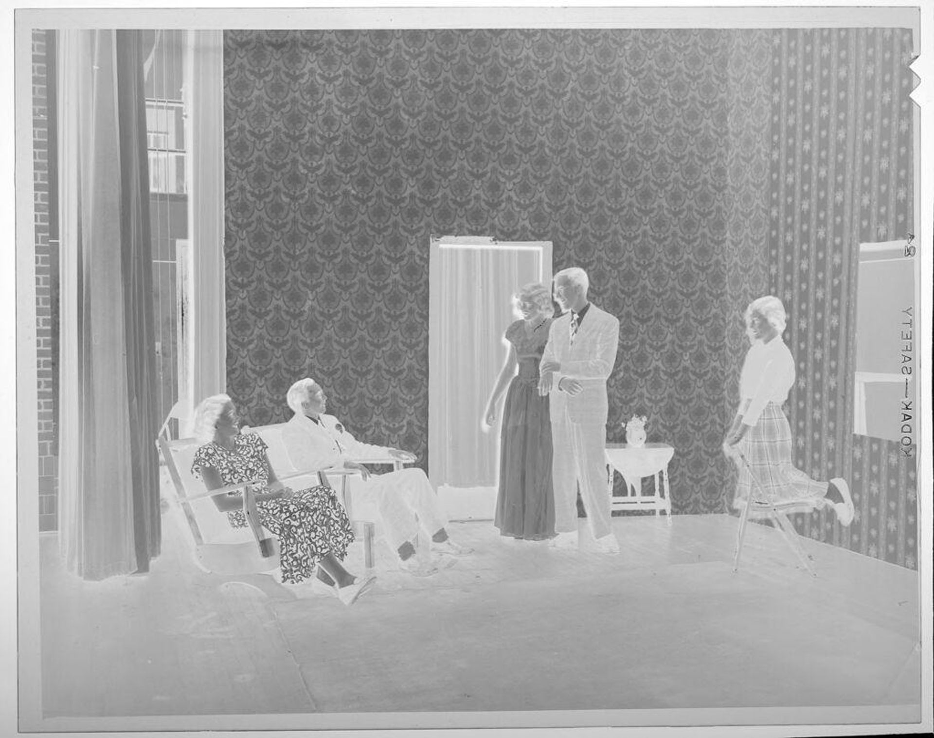 Untitled (people smiling at well-dressed young couple) by Lucian and Mary Brown