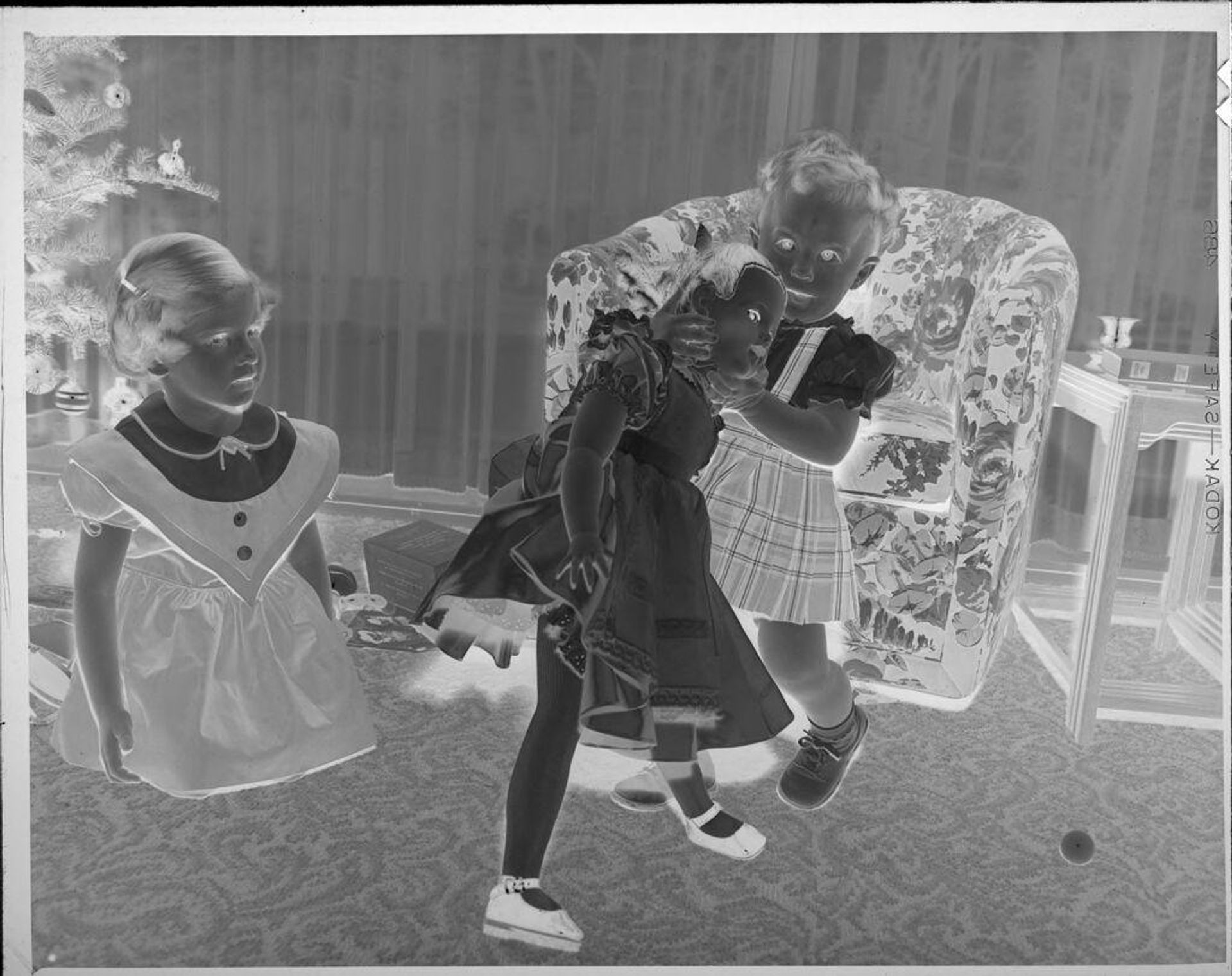 Untitled (girls with large doll) by Lucian and Mary Brown