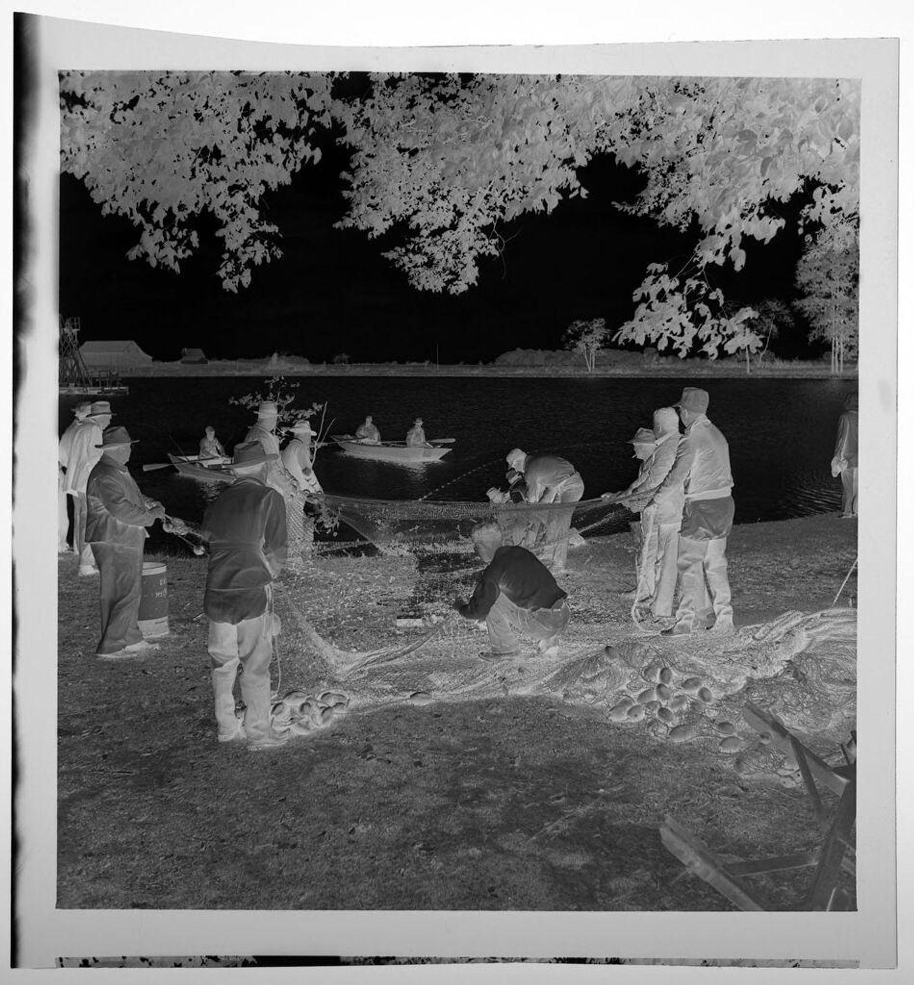 Untitled (fishermen stretching nets on shore of lake) by Jack Gould