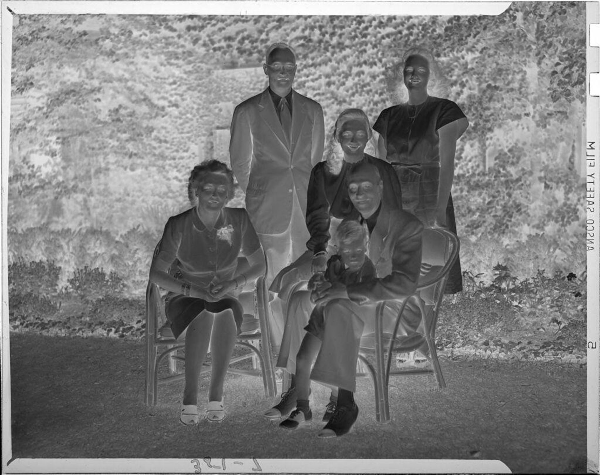 Untitled (family portrait outside) by John Howell