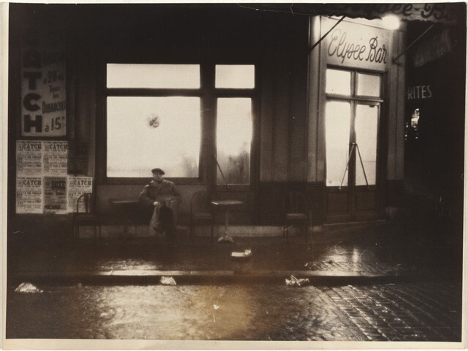 Outdoor café at night, Paris by Robert Frank