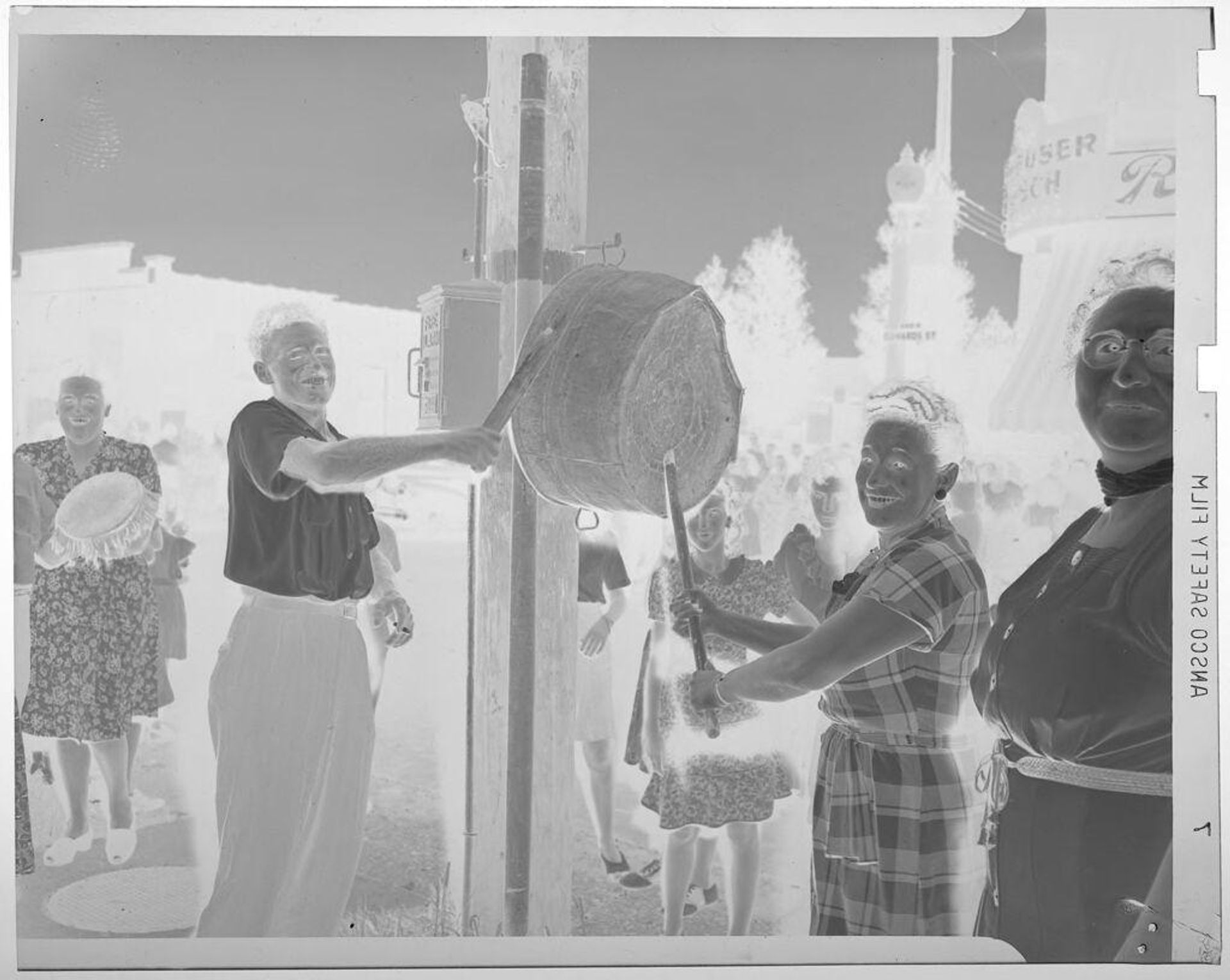 Untitled (V J day: people banging on metal tub) by Jack Gould