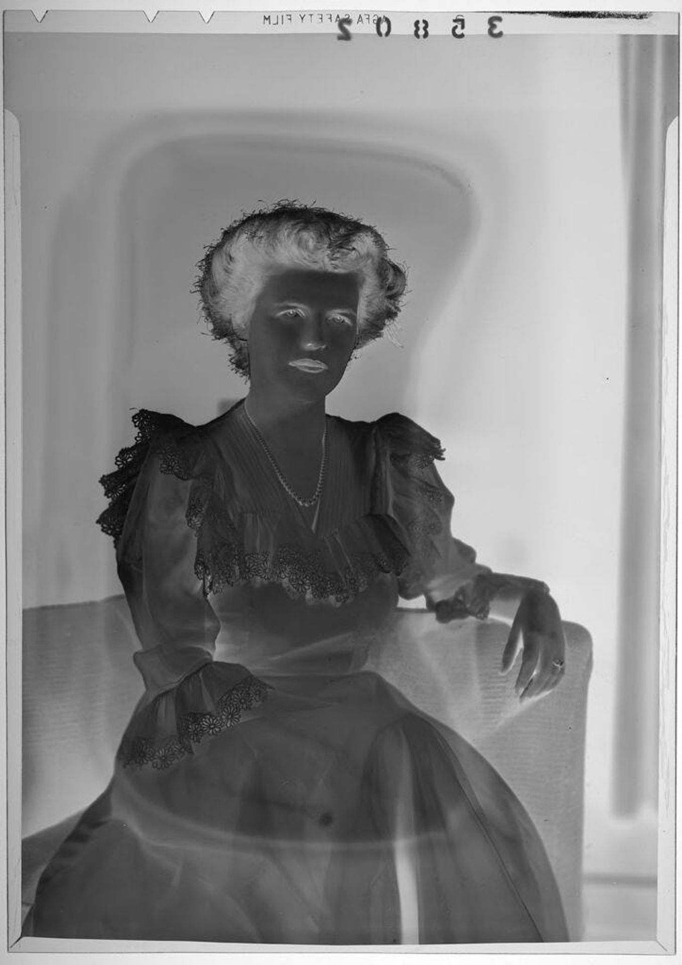 Untitled (studio portrait of woman in flower lace dress) by Martin Schweig
