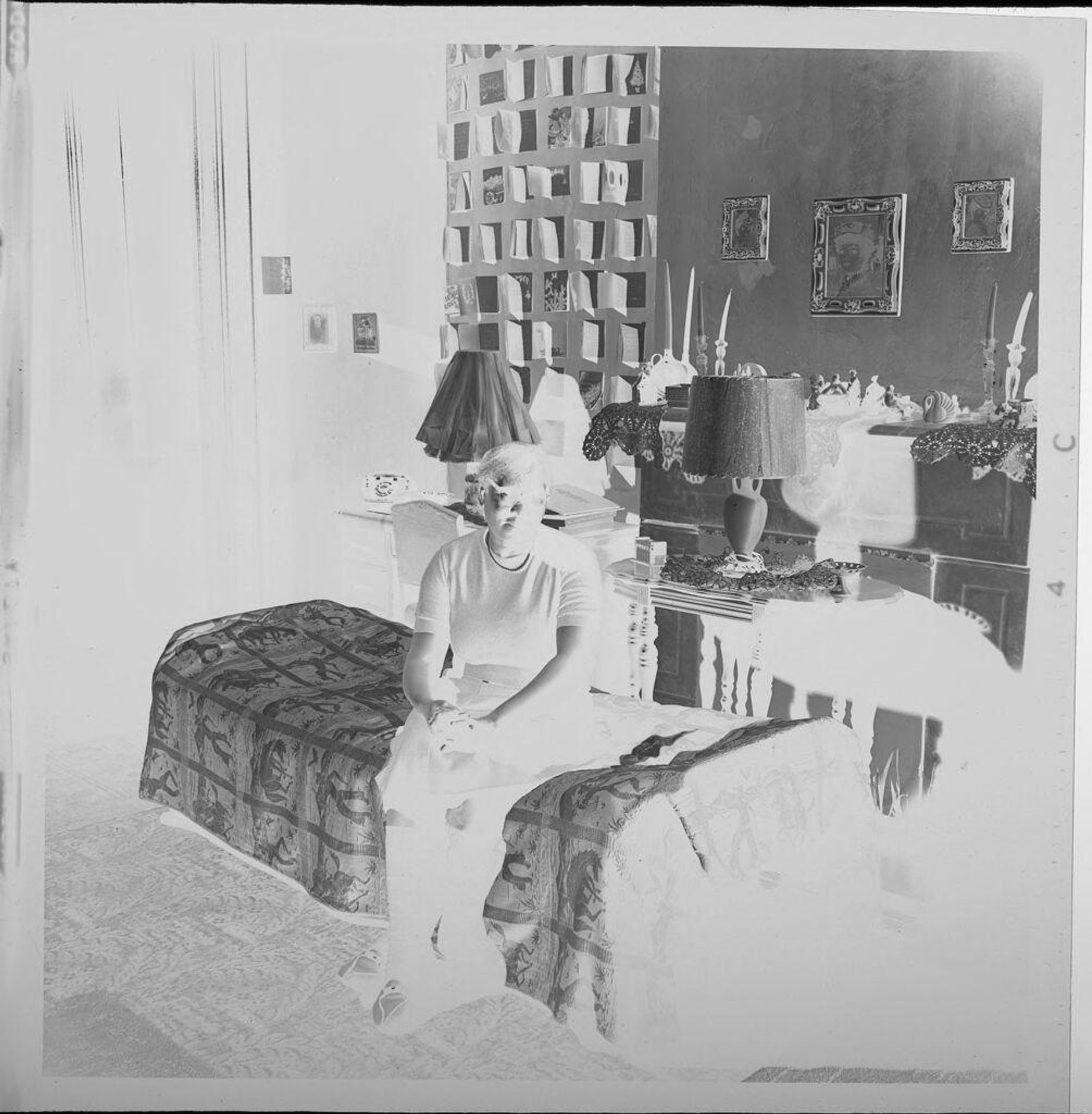 Untitled (woman on bed inside run-down house) by Jack Gould