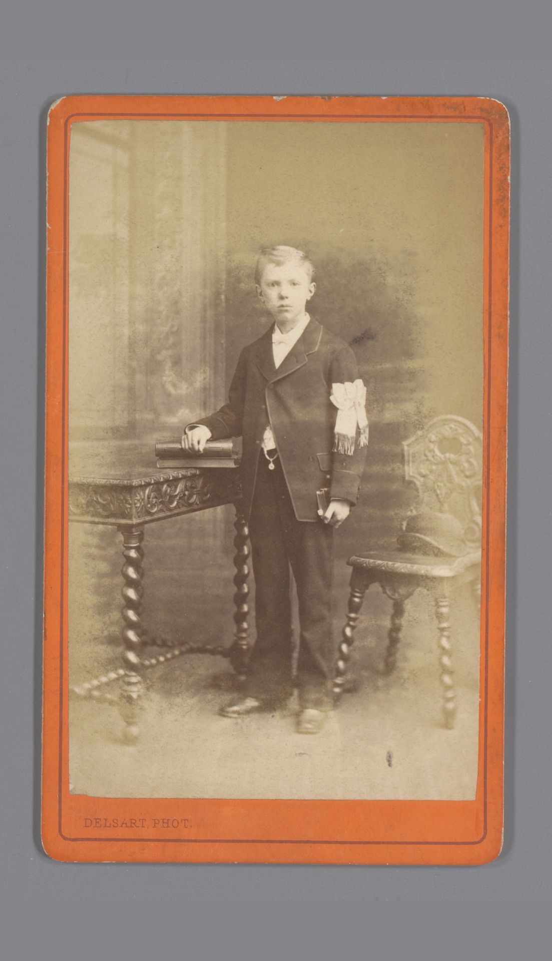 Portret van een onbekende jongen met een witte strik om arm by Jules Delsart