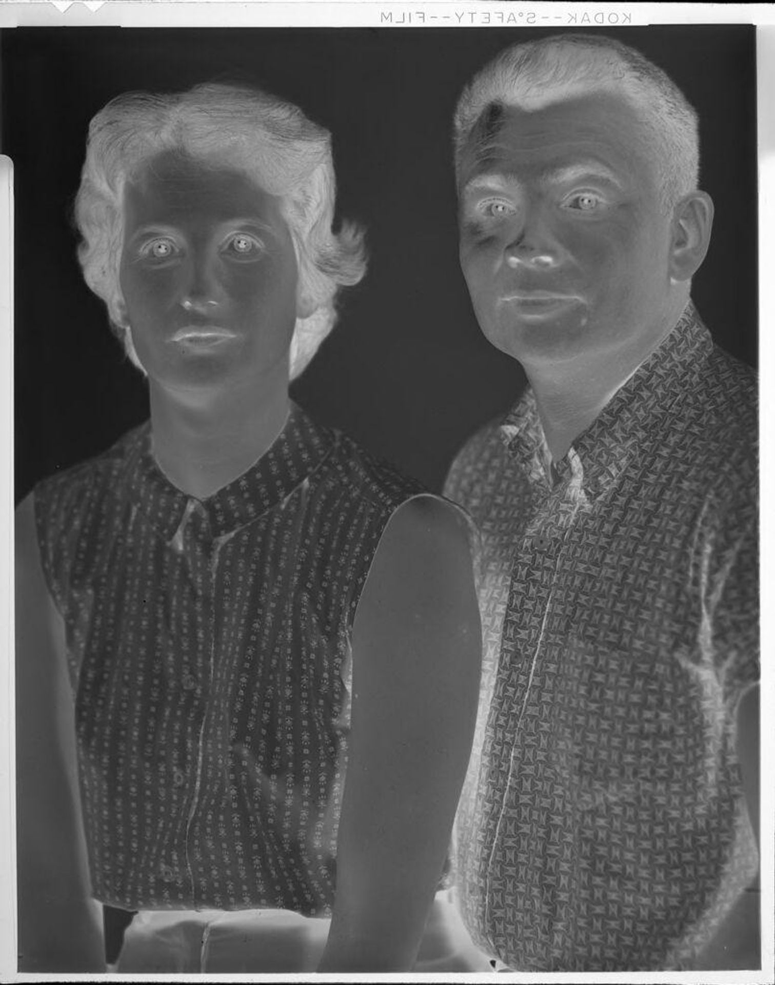 Untitled (portrait of man and woman, wearing patterned shirts) by John Howell