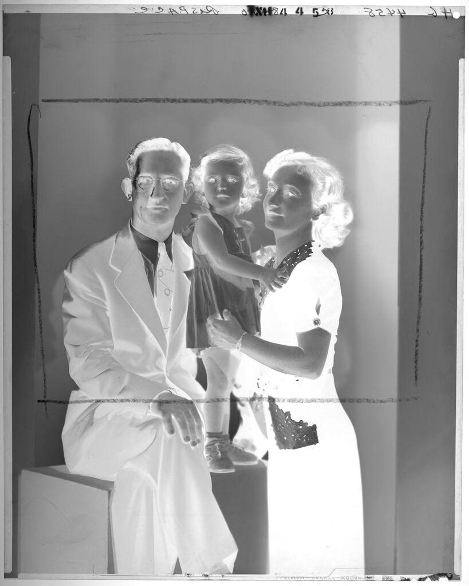 Untitled (portrait of little girl in sundress between her parents) by Paul Gittings