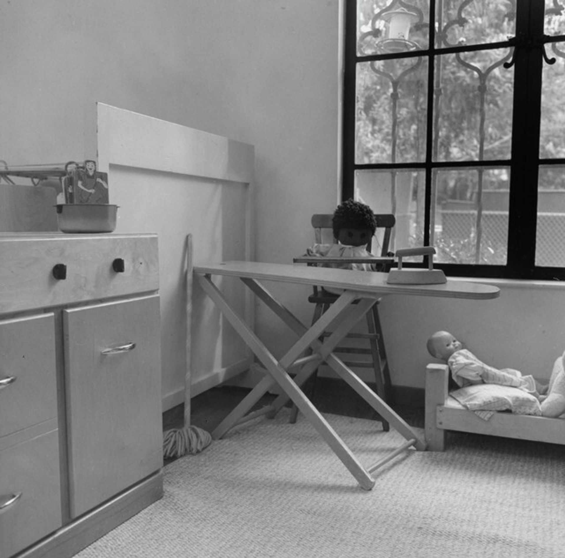 Children’s Play Space at Mills College Day Care Center–Ironing Board and Doll Bed by Joanne Leonard