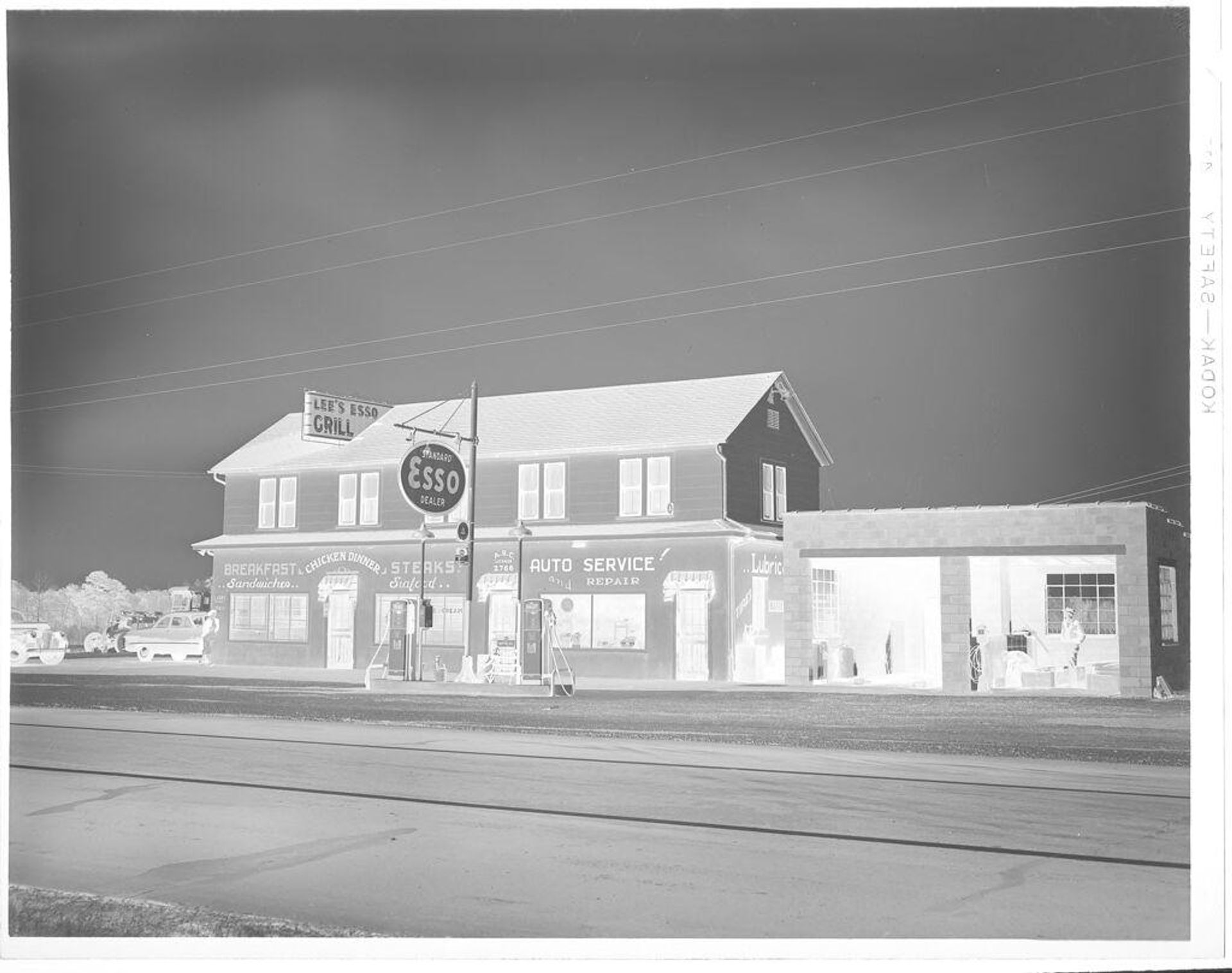 Untitled (Lee's Esso Grill, exterior seen from street) by Hamblin Studio
