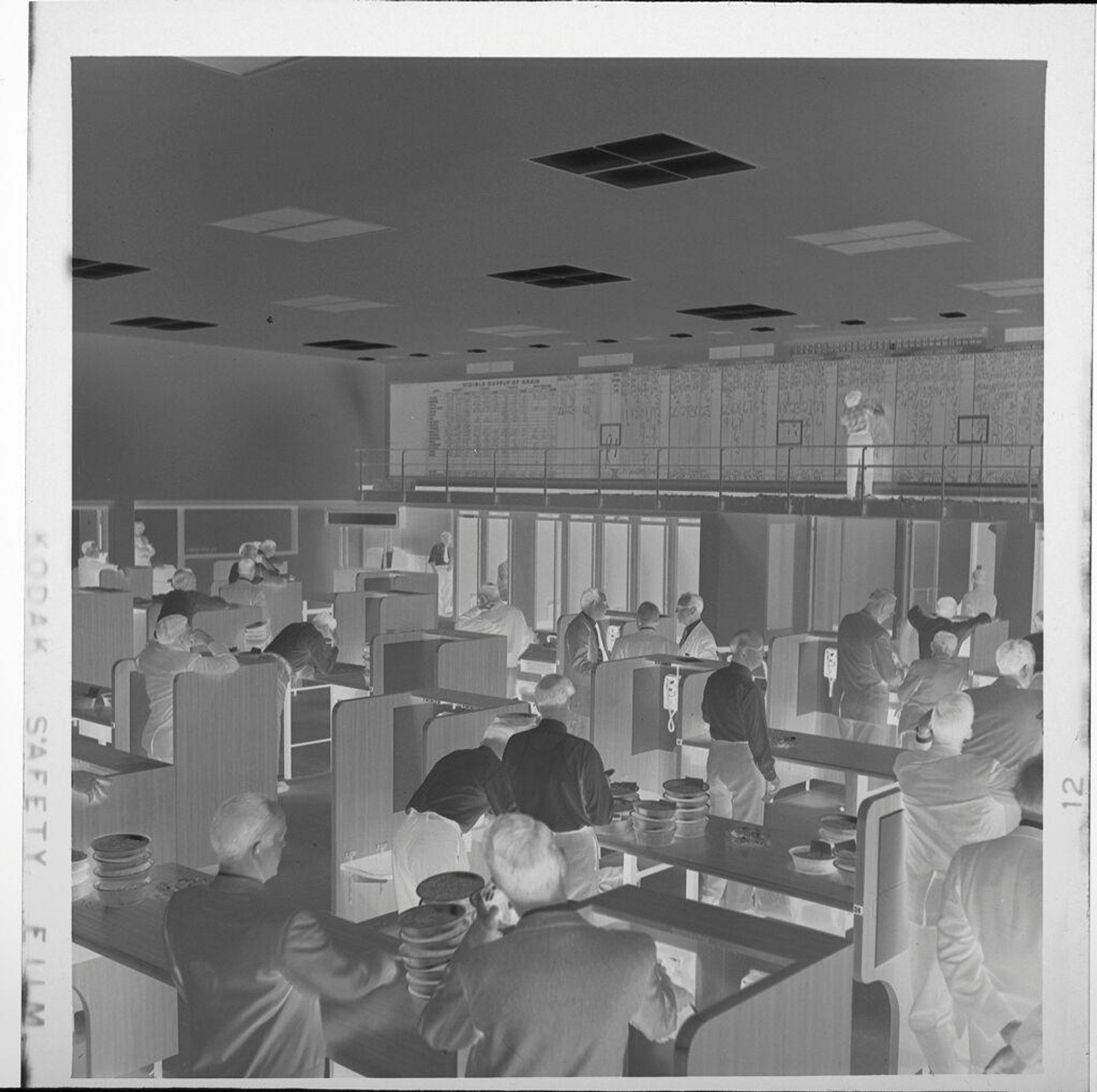 Untitled (businesspeople at desks in Mercantile Exchange auditorium) by Jack Gould