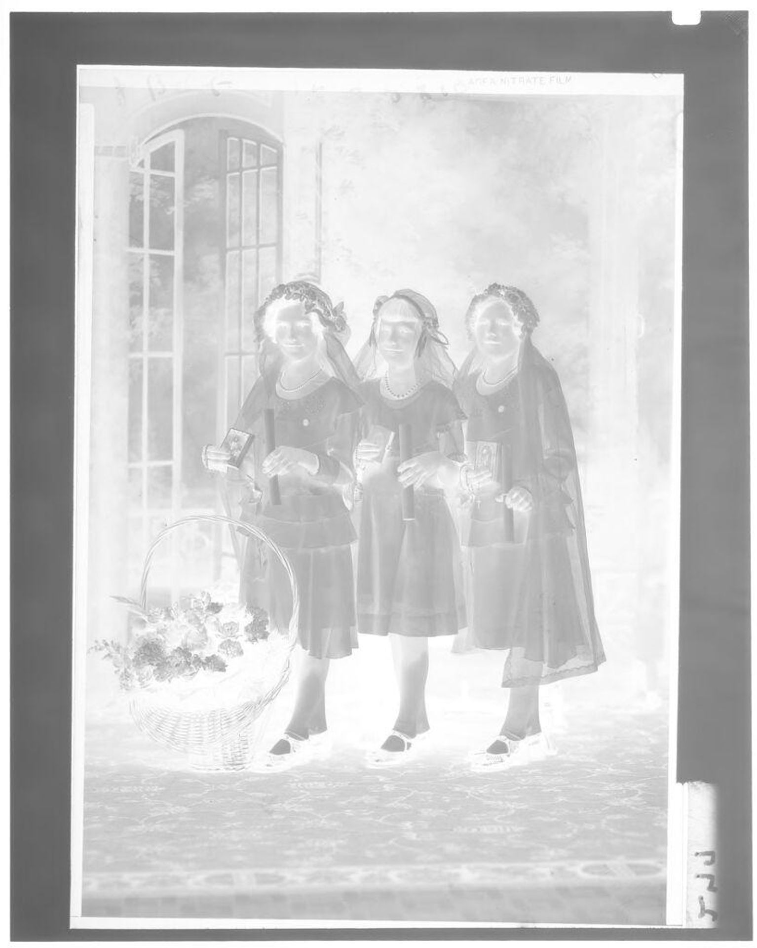 Untitled (three girls with bibles, candles and rosaries) by John Deusing