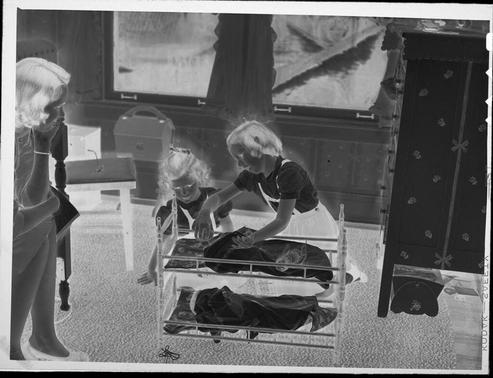 Untitled (girls playing with dolls) by Lucian and Mary Brown