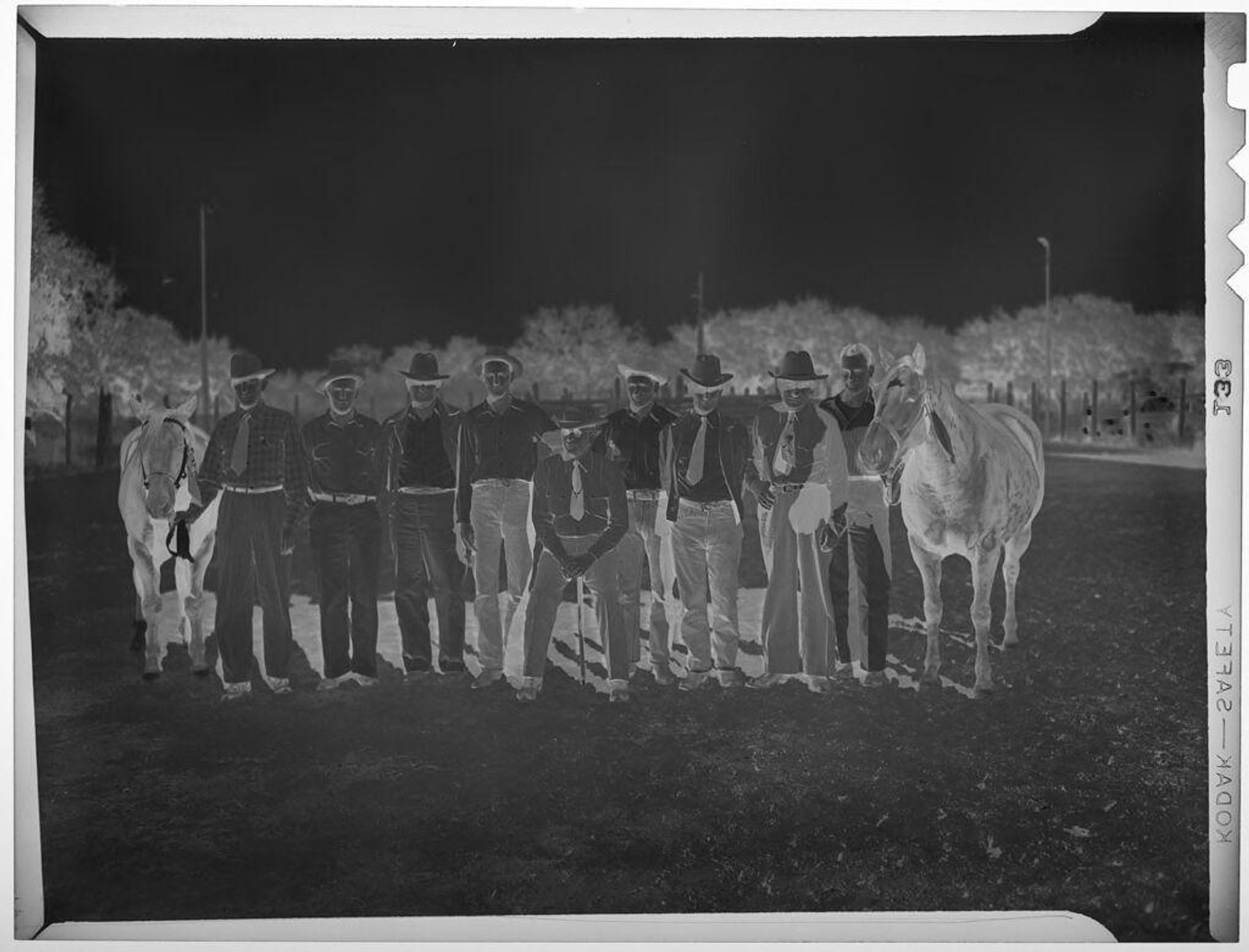 Untitled (group of men with two horses at Quarterhorse Show) by Harry Annas