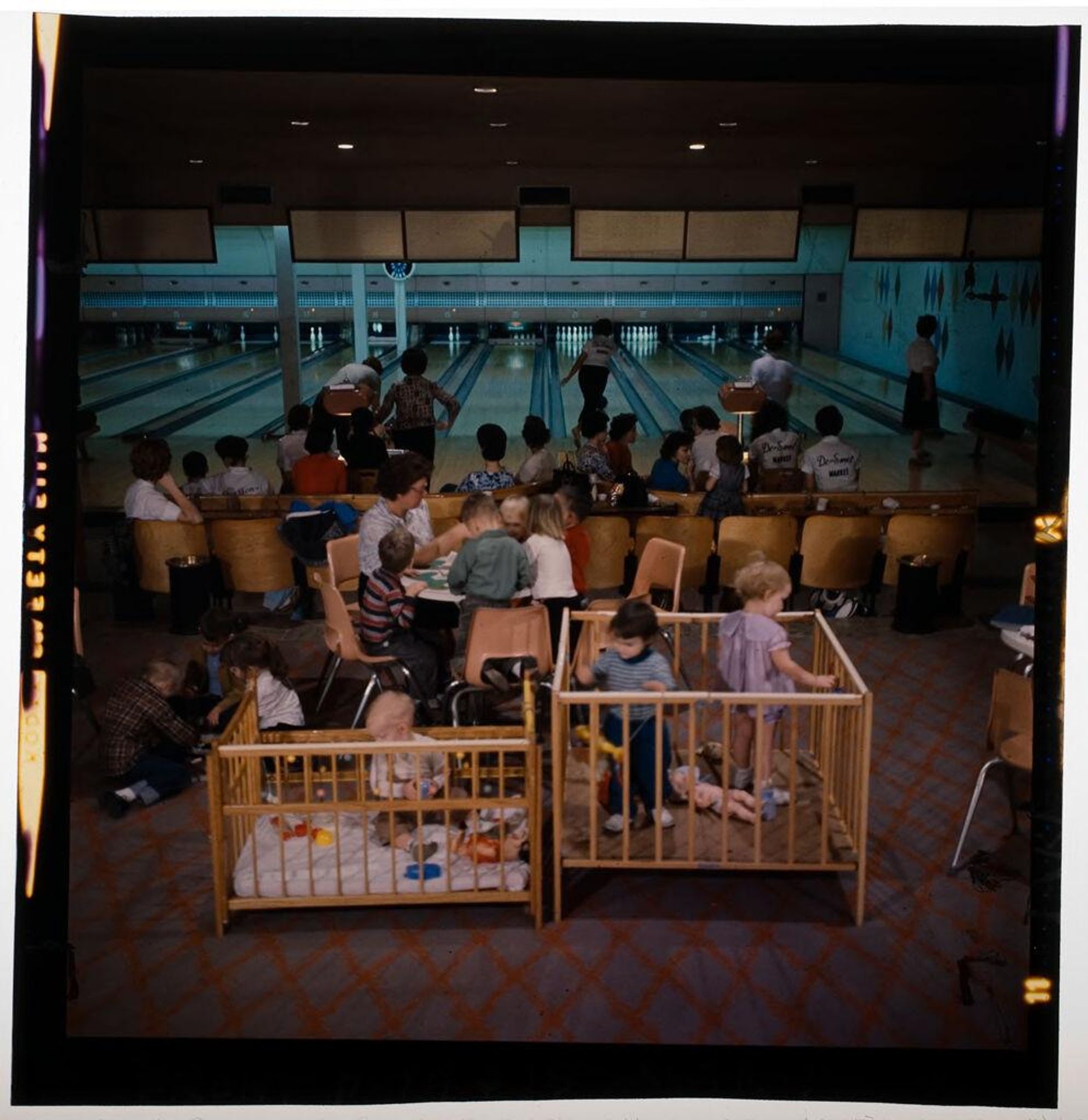 Untitled (bowling alley with women bowling and children in playpens) by Jack Gould