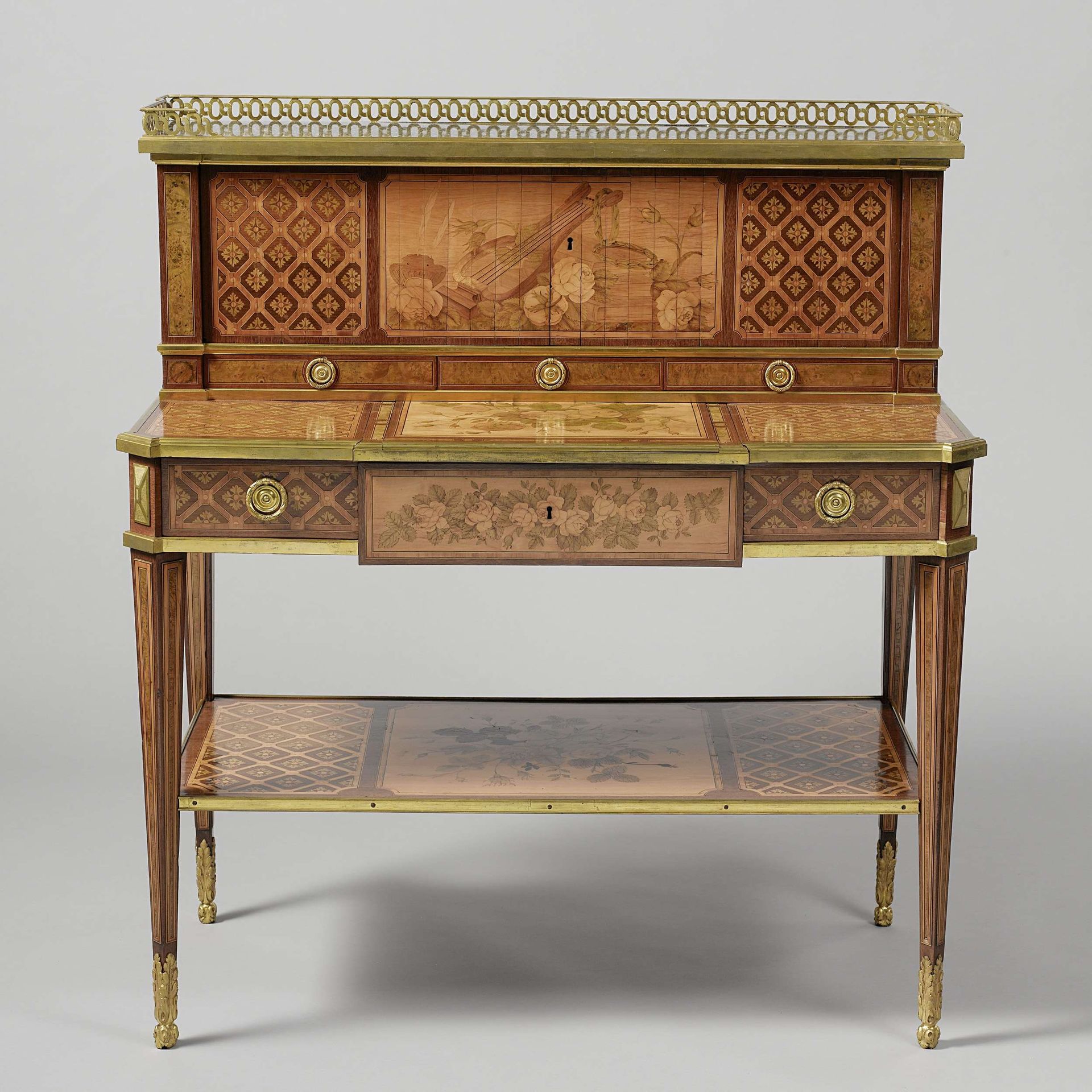Writing desk with a raised back by Jean Henri Riesener