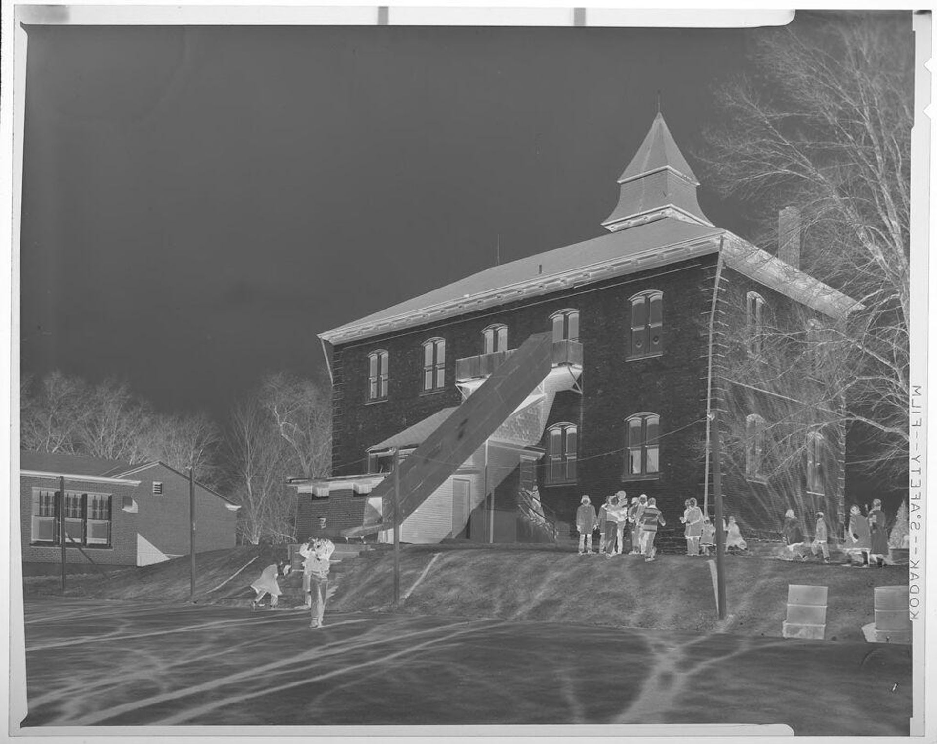 Untitled (exterior of elementary school, children in front) by Jack Gould