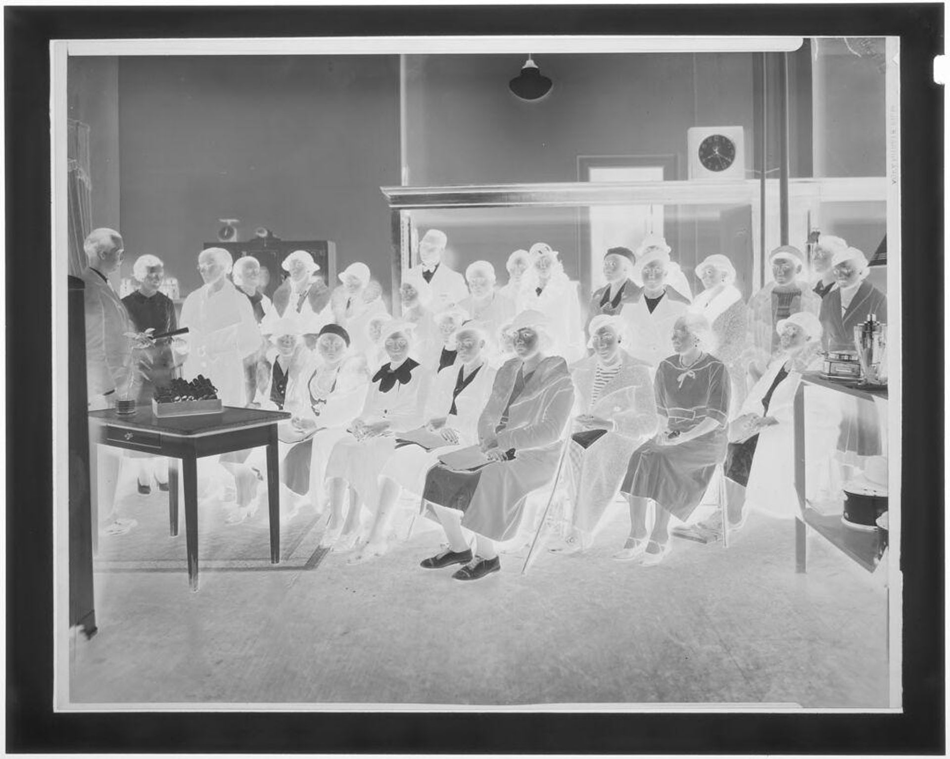 Untitled (large group of teachers gathered inside building) by Hamblin Studio