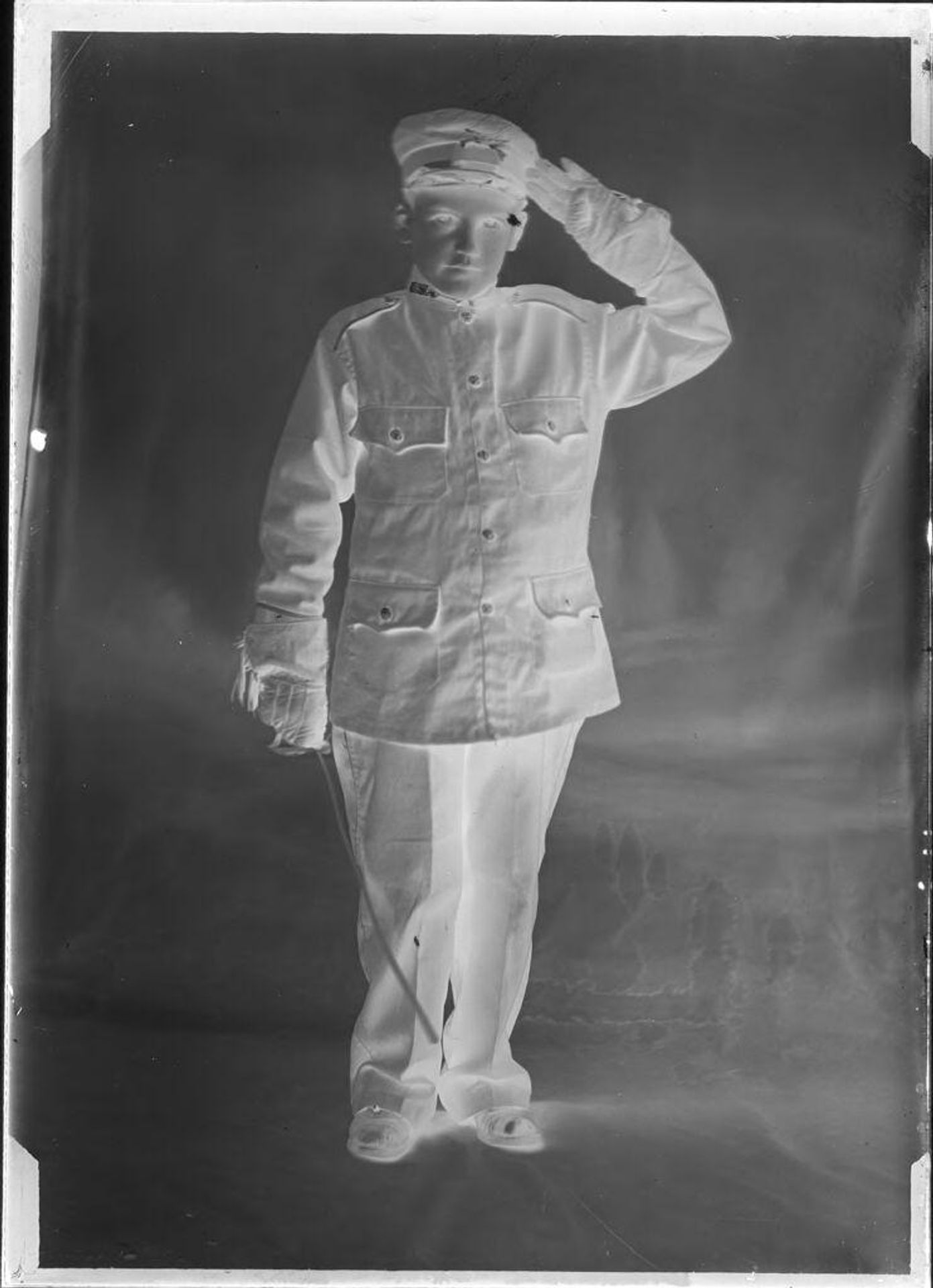 Untitled (portrait of young man saluting) by John Deusing