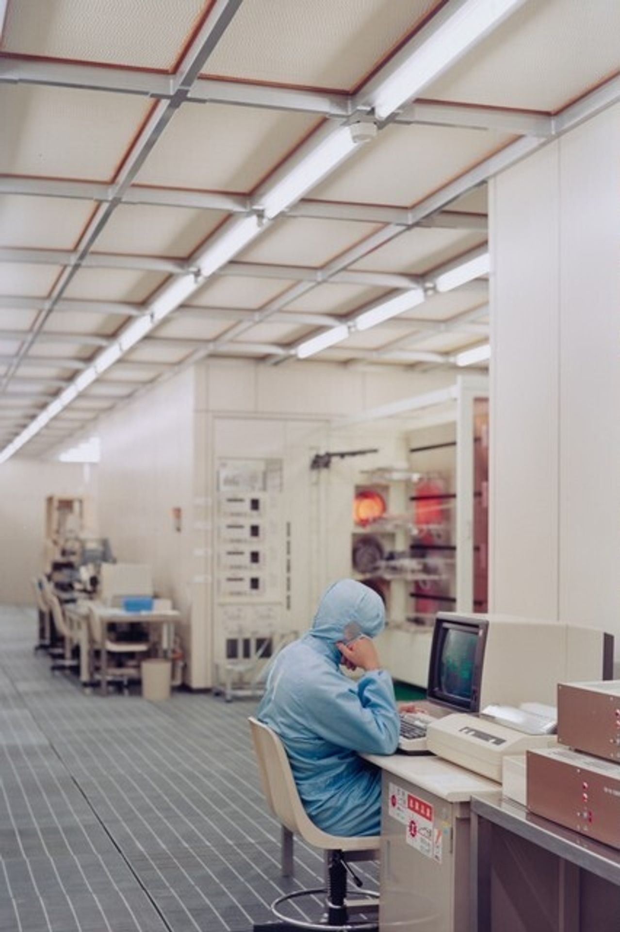 Worker, clean room, Toshiba, Kawasaki City, Japan by Lewis Baltz
