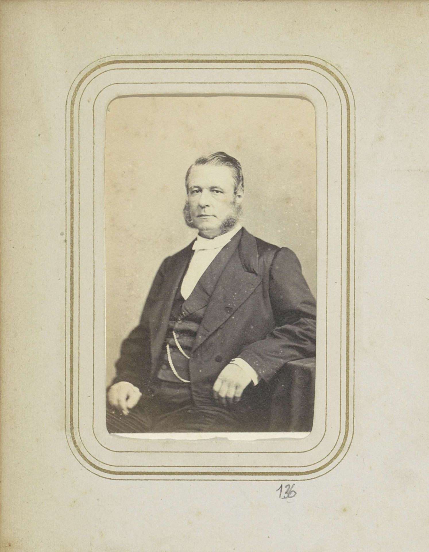 Portret van een man met een snor in een jas by Woodbury & Page