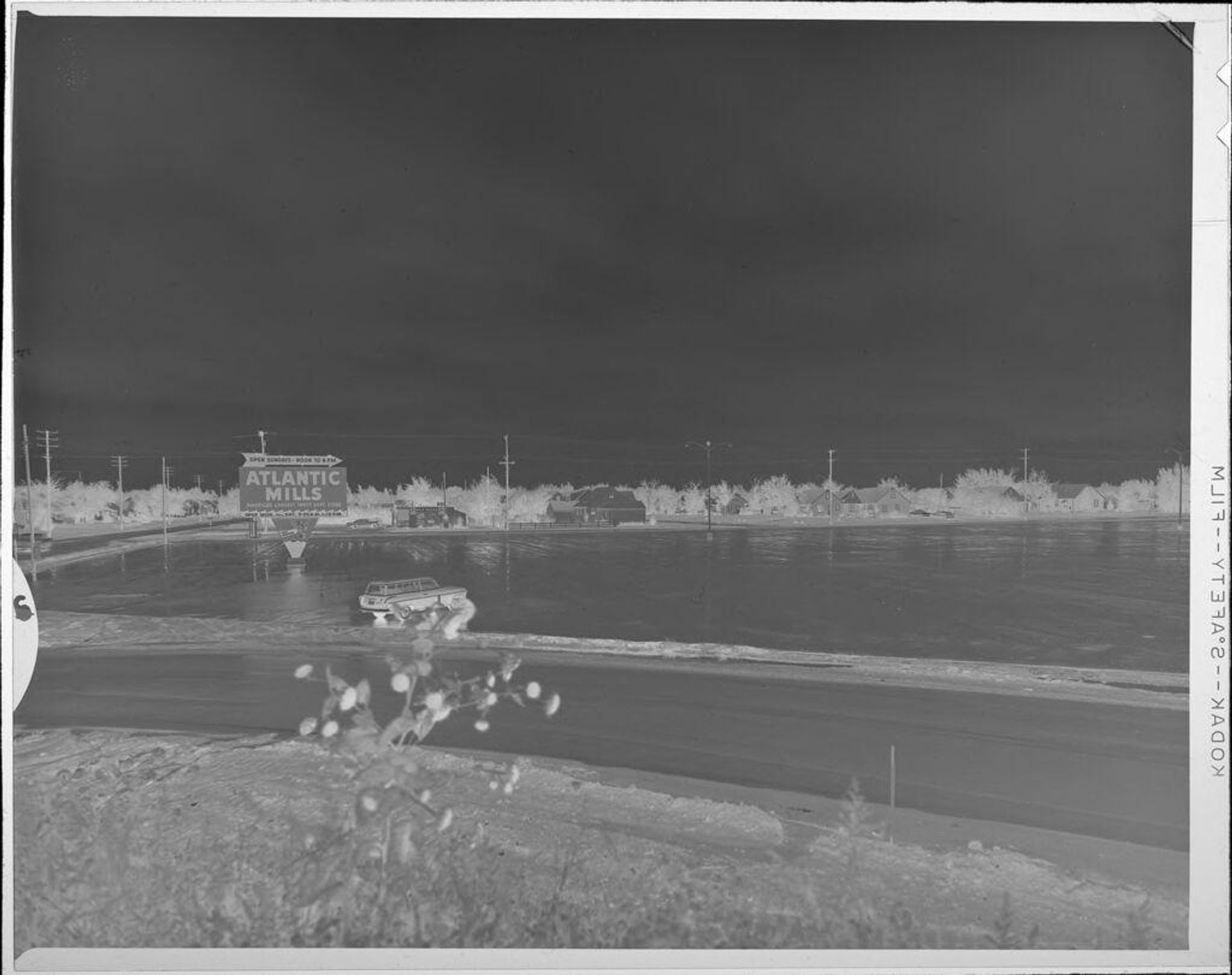 Untitled (flooded parking lot) by Lucian and Mary Brown