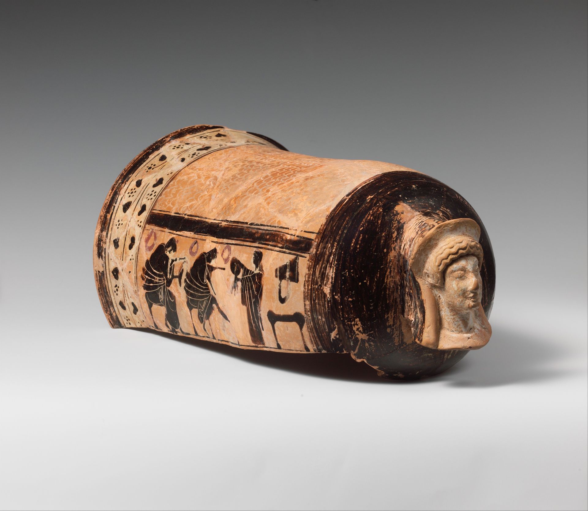 Terracotta onos (leg guard used in carding wool) by Golonos Group