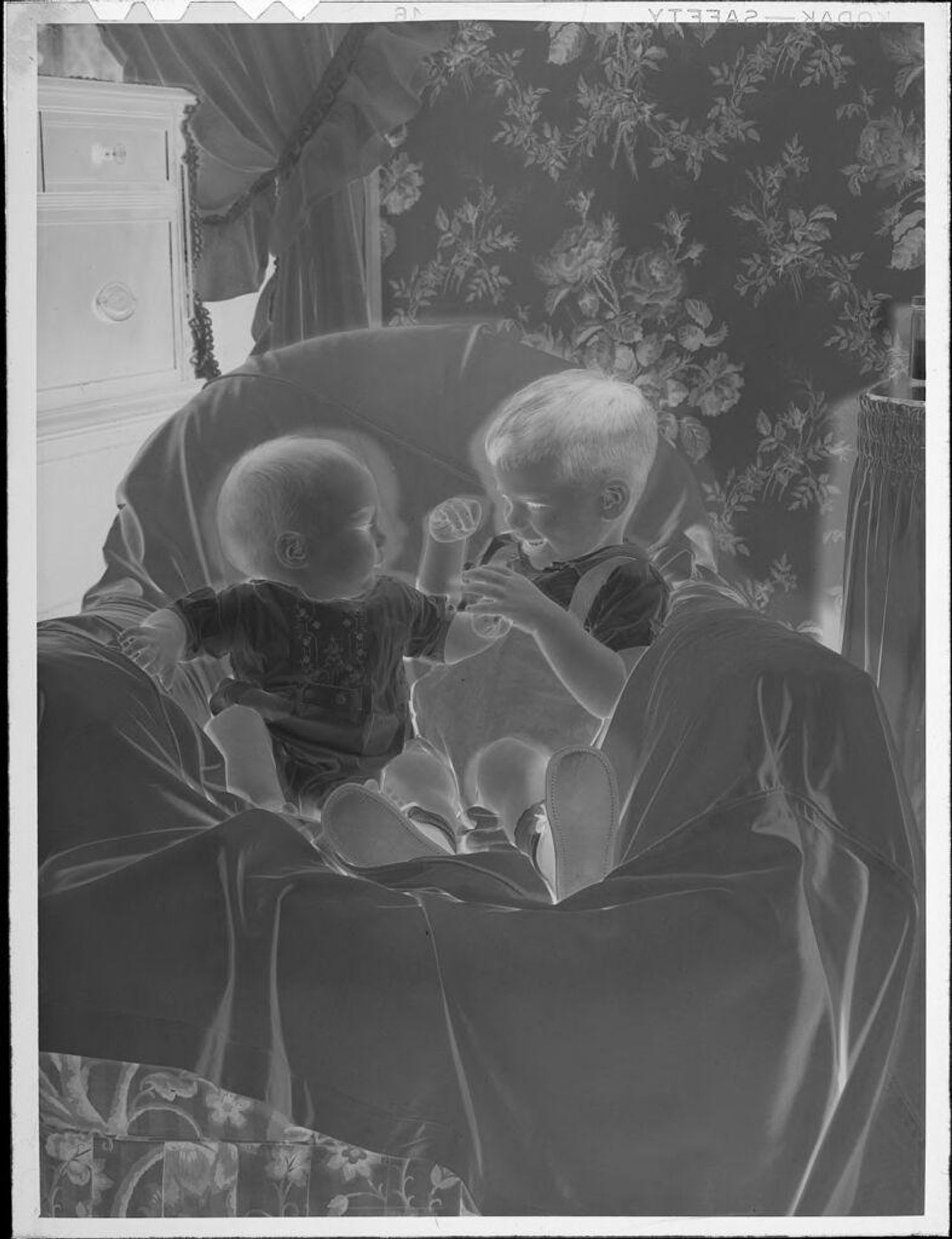 Untitled (baby and little boy on chair) by Lucian and Mary Brown