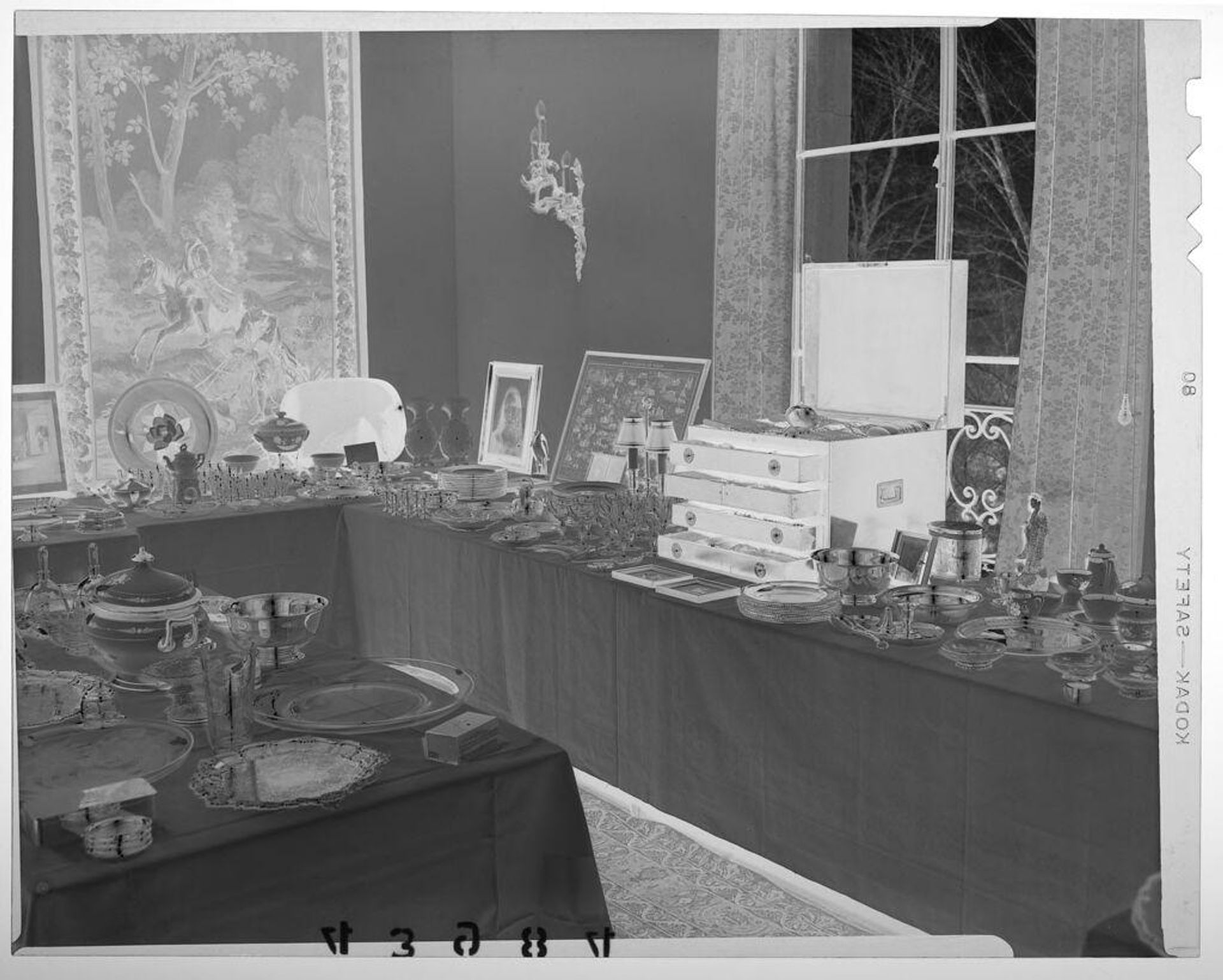 Untitled (view of dinnerware and china on tables in elegant room) by Martin Schweig