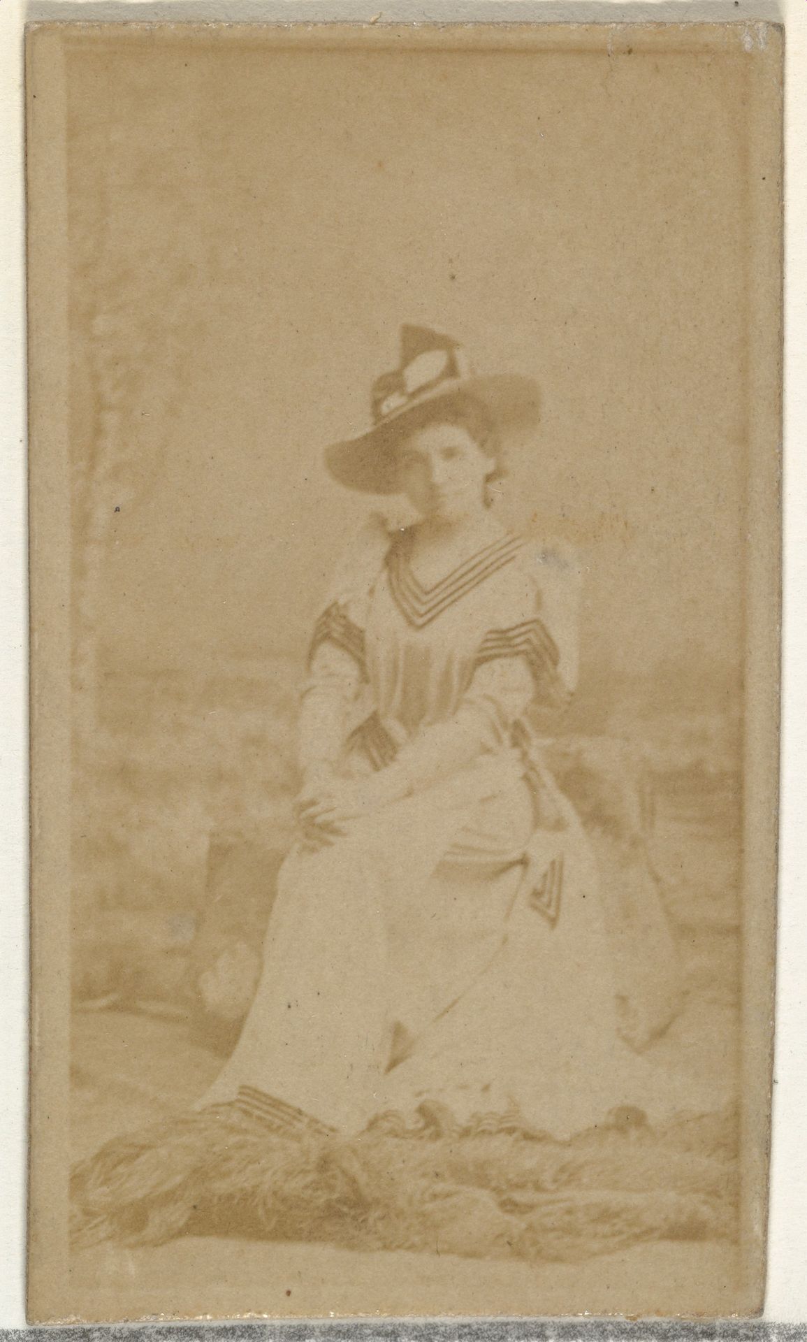 [Seated actress], from the Actors and Actresses series (N145-8) issued by Duke Sons & Co. to promote Duke Cigarettes by W. Duke, Sons & Co.
