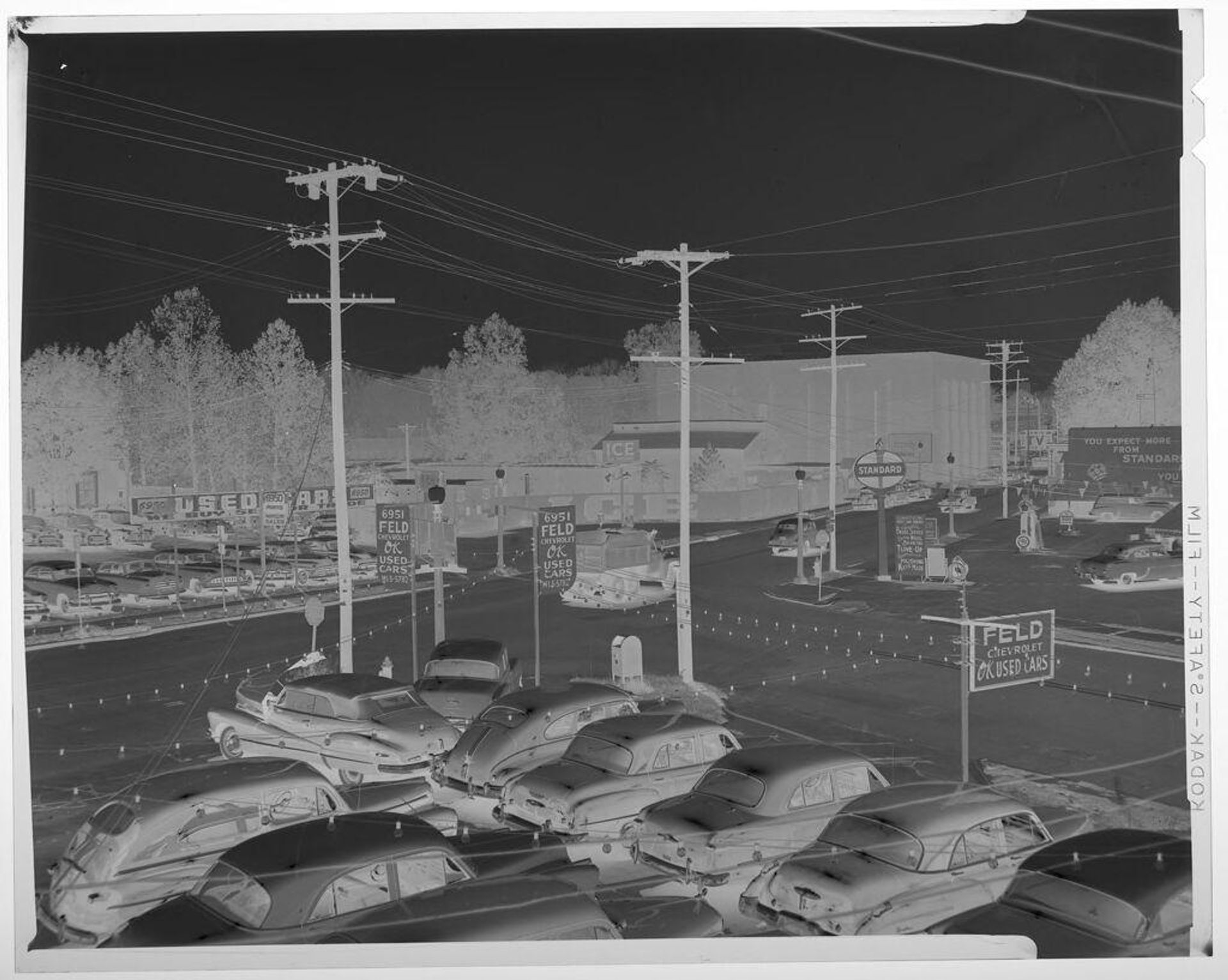 Untitled (cars in used car lot) by Jack Gould