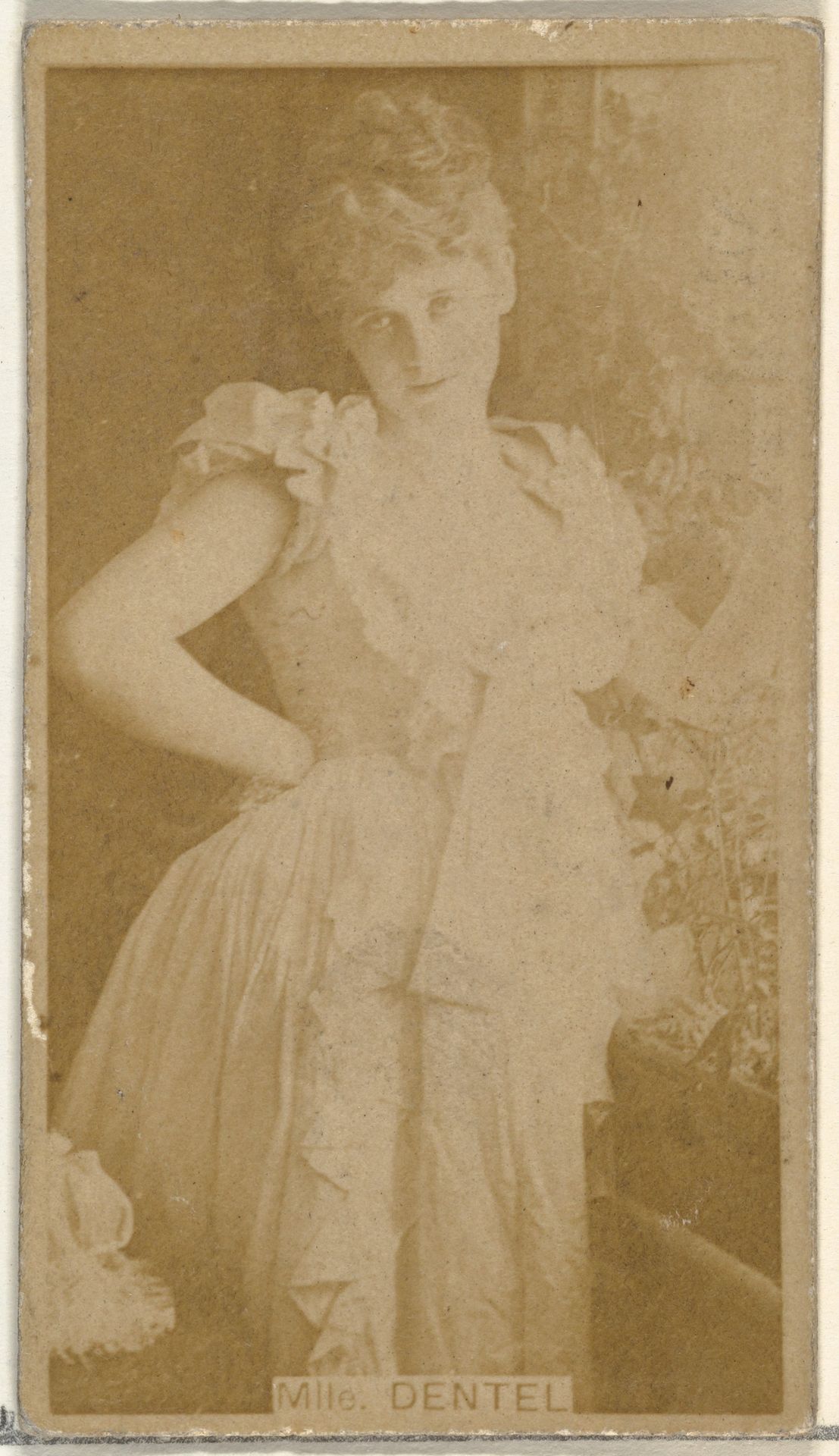 Mlle. Dentel, from the Actors and Actresses series (N145-8) issued by Duke Sons & Co. to promote Duke Cigarettes by W. Duke, Sons & Co.
