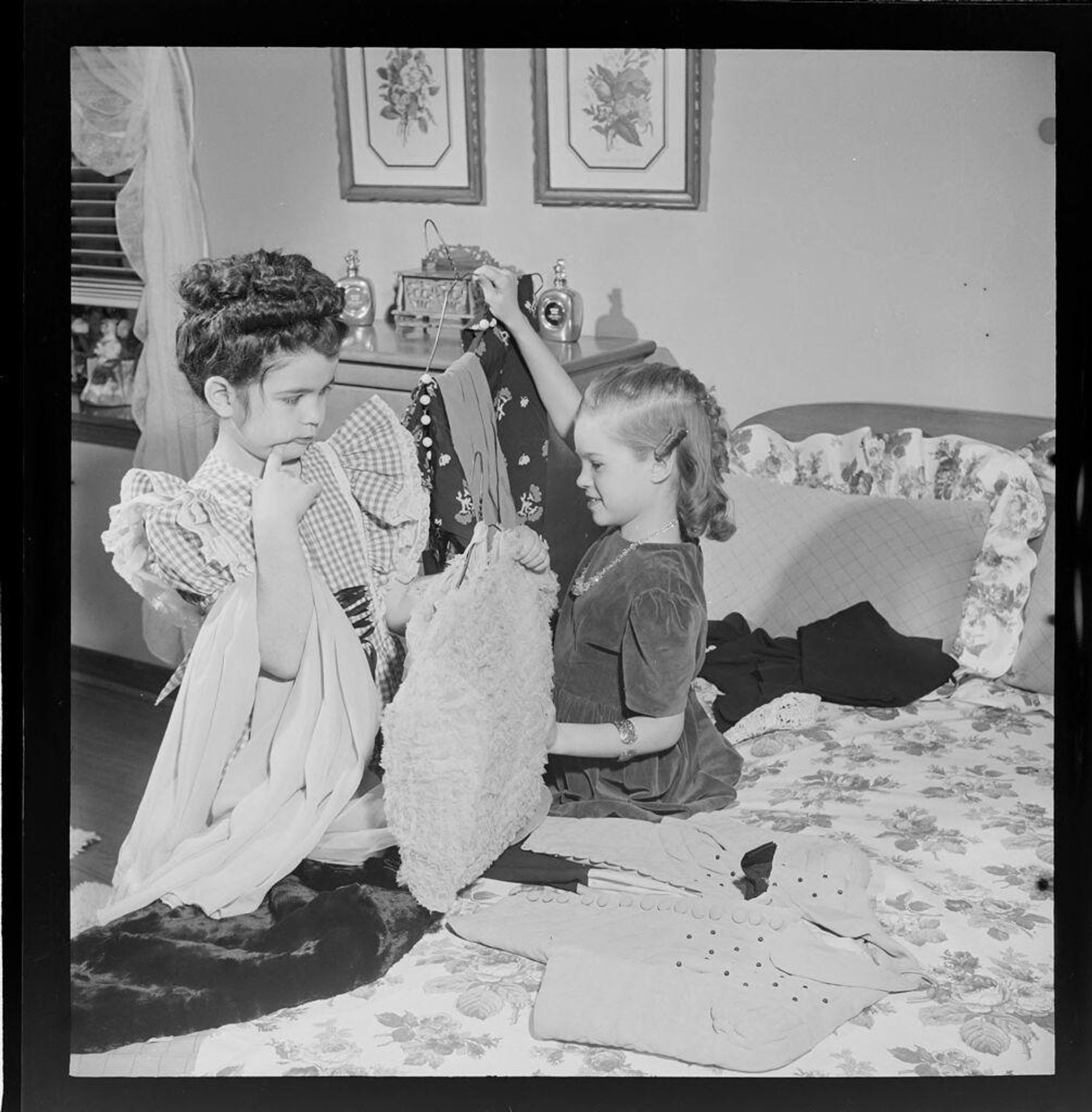 Untitled (girls playing dress-up and trying on clothes) by Jack Gould