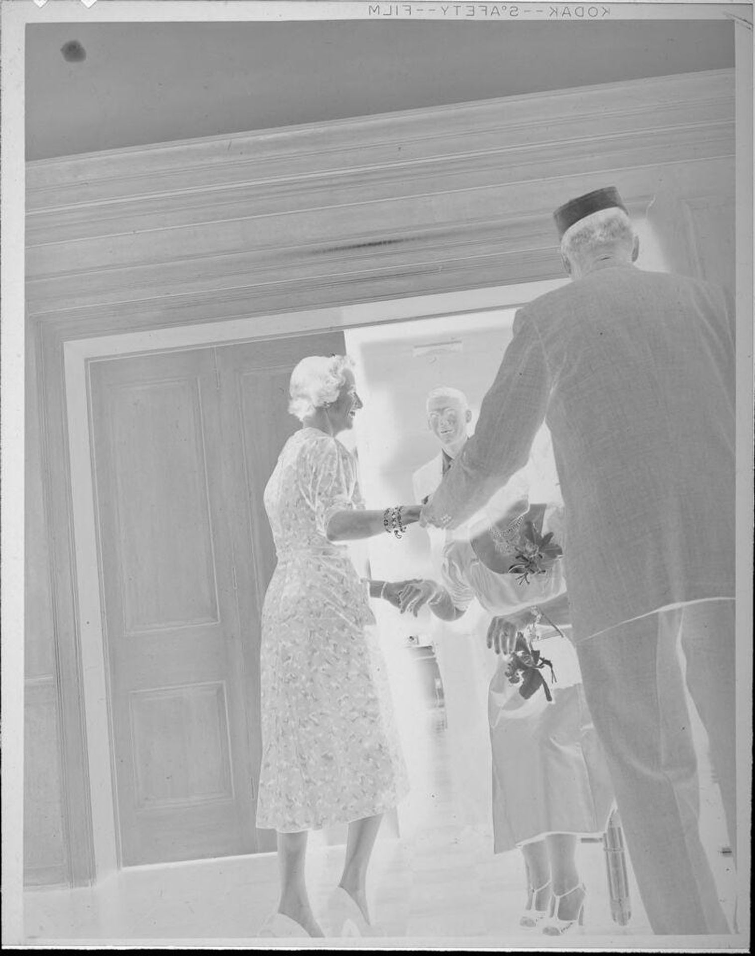 Untitled (people walking out of ballroom) by Lucian and Mary Brown