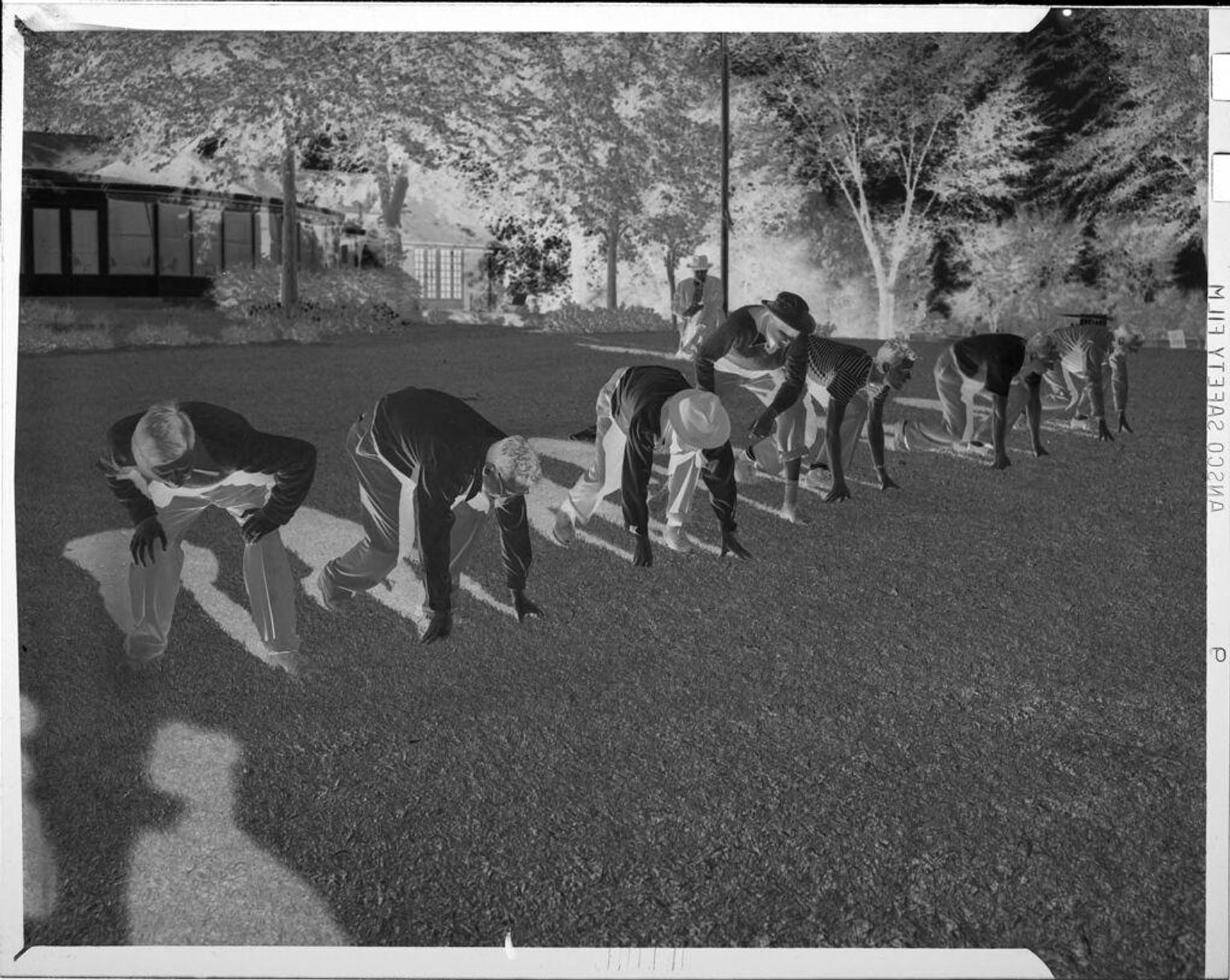 Untitled (men lined-up for race) by John Howell