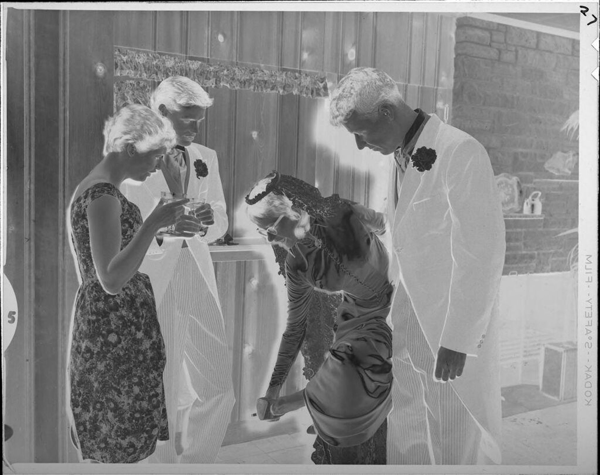 Untitled (bride fixing shoe) by Lucian and Mary Brown