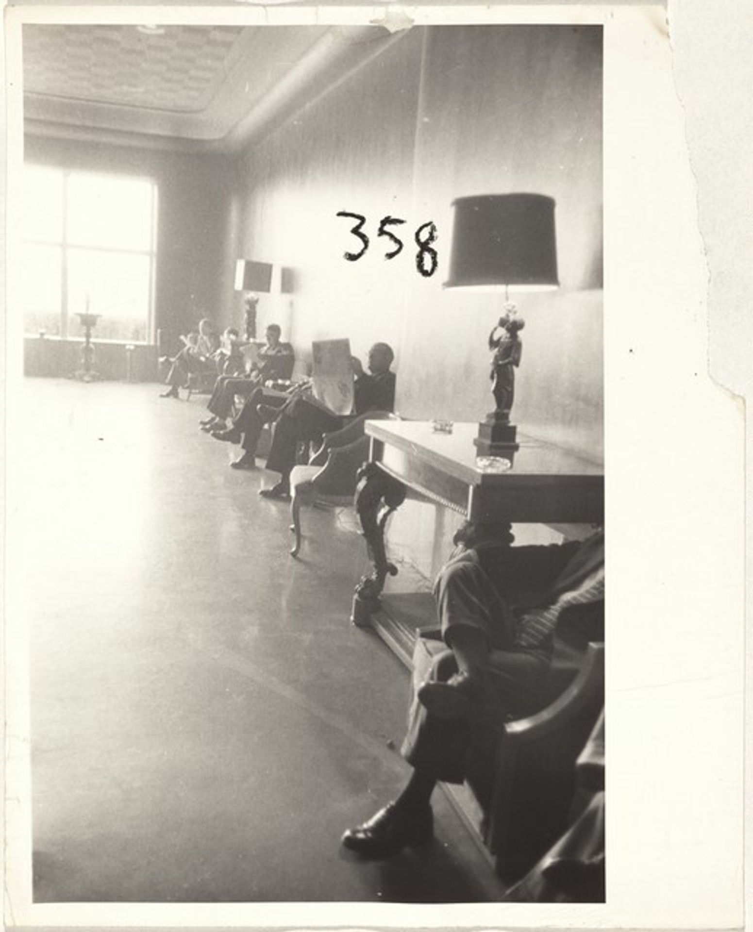 Men seated in lobby--Houston, Texas by Robert Frank