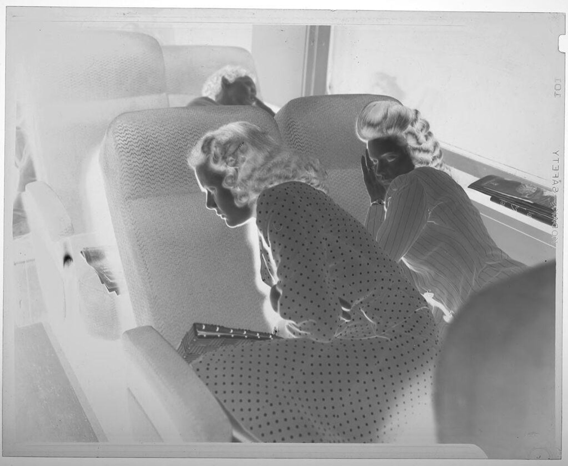 Untitled (two women sleeping on train seats) by Jack Gould