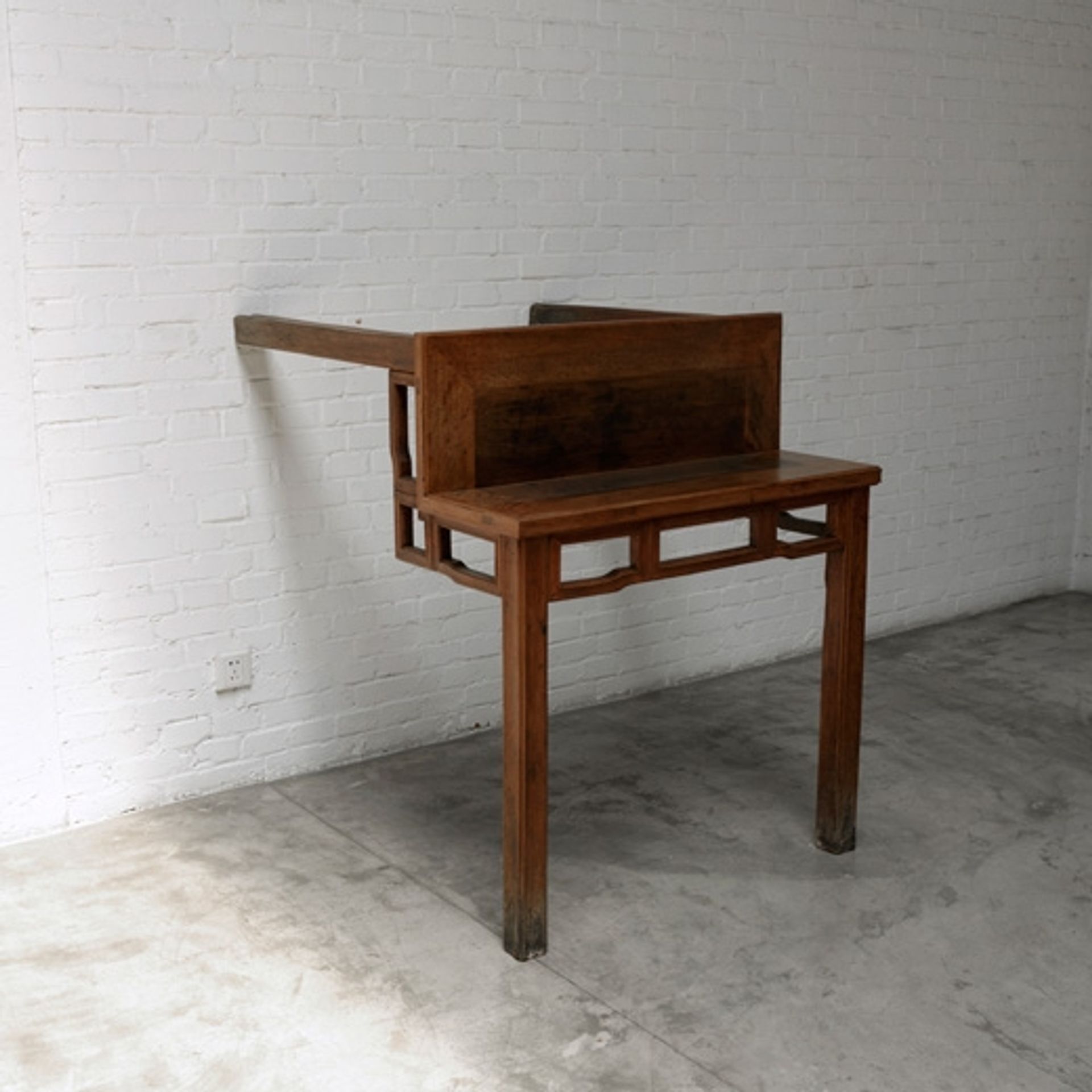 Table with Two Legs on the Wall by Ai Weiwei