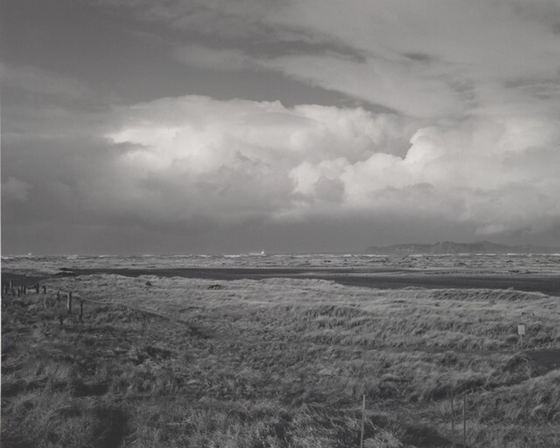 Winter, northwest across dunes and tidal marsh inside the South Jetty, Clatsop County, Oregon by Robert Adams