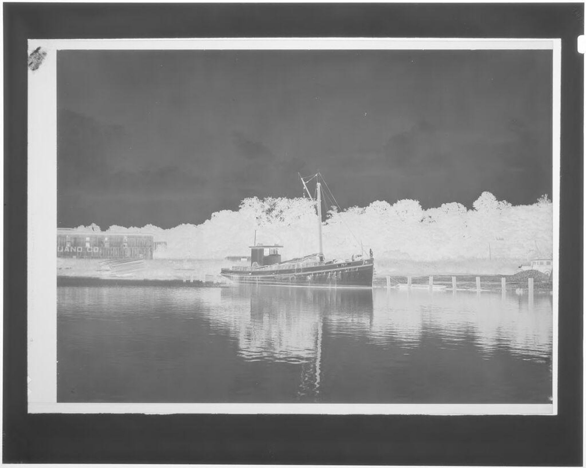 Untitled (boat moored at shore) by Hamblin Studio