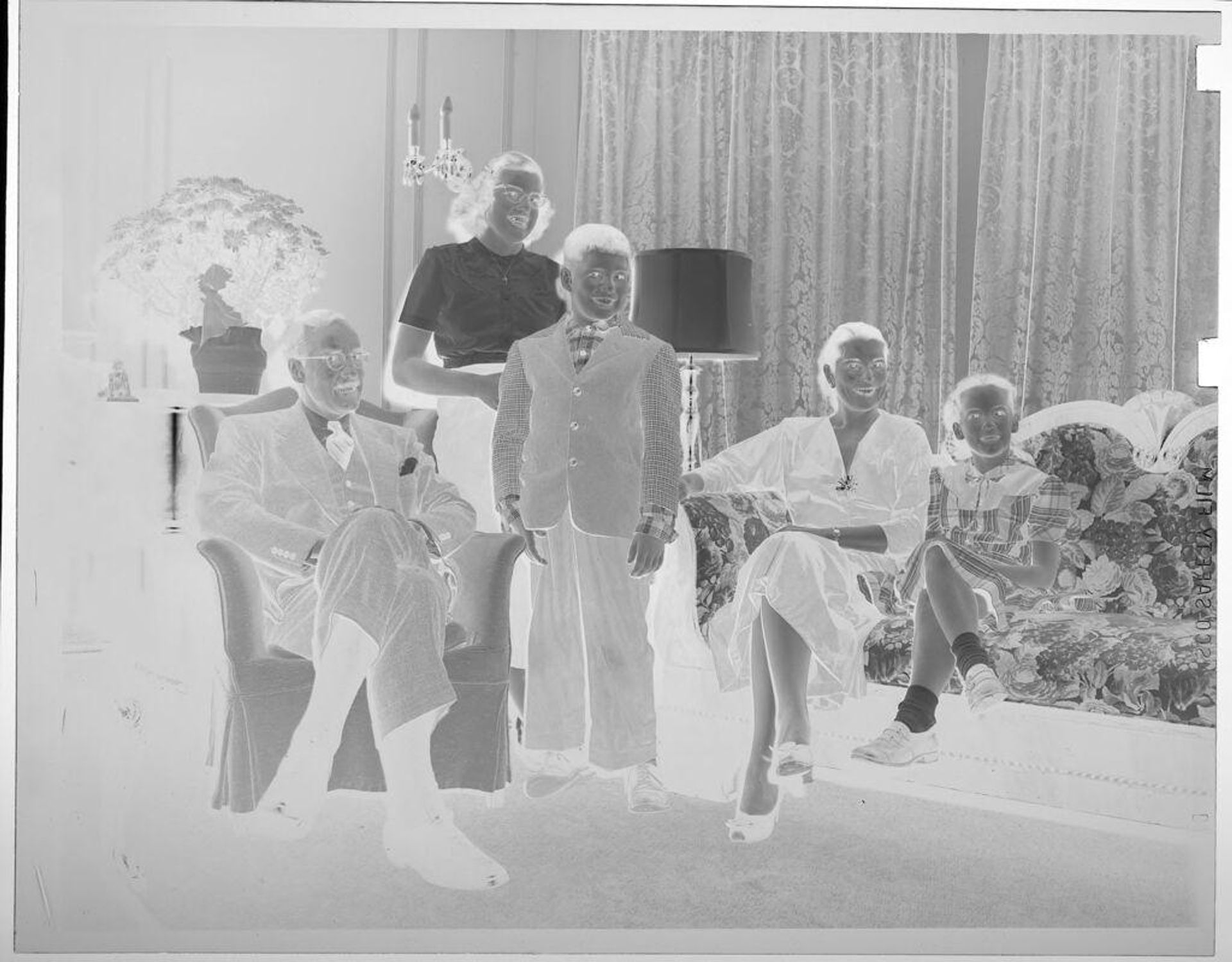 Untitled (family portrait in living room) by Lucian and Mary Brown