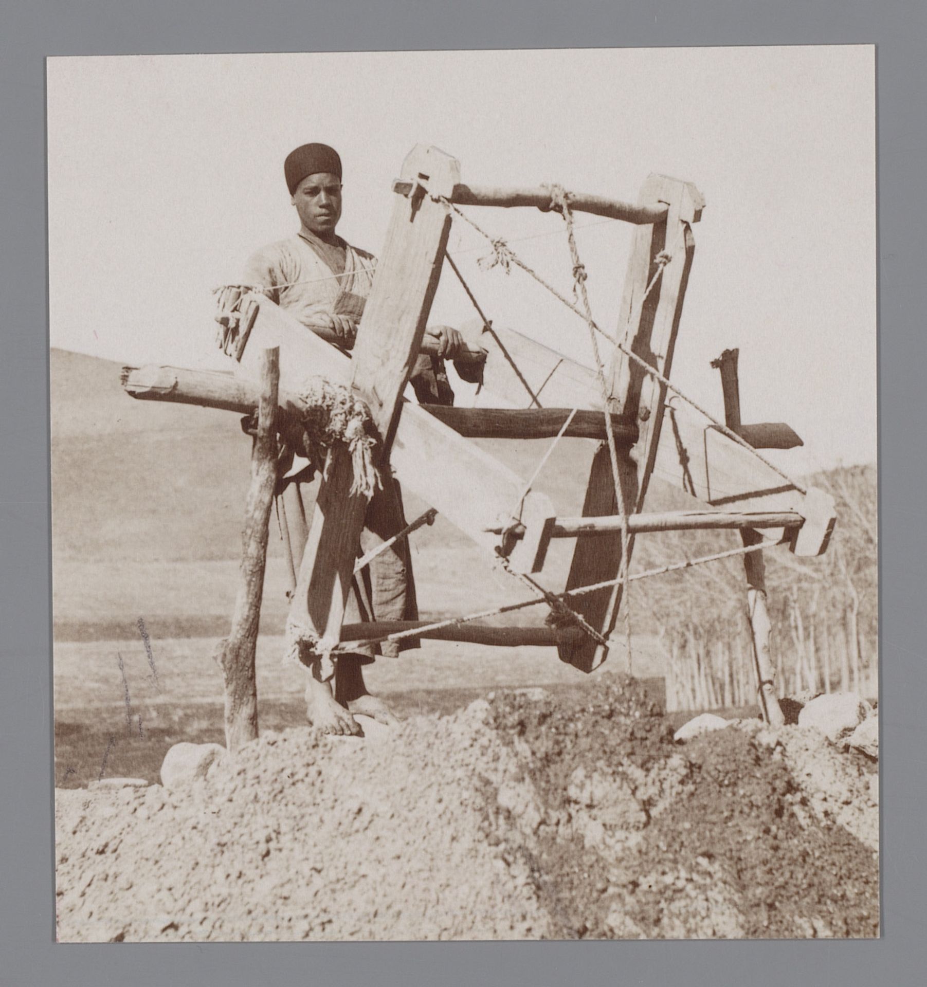 Landschap met jongen met een ploeg/gereedschap [?], Iran [?] by Antoine Sevruguin