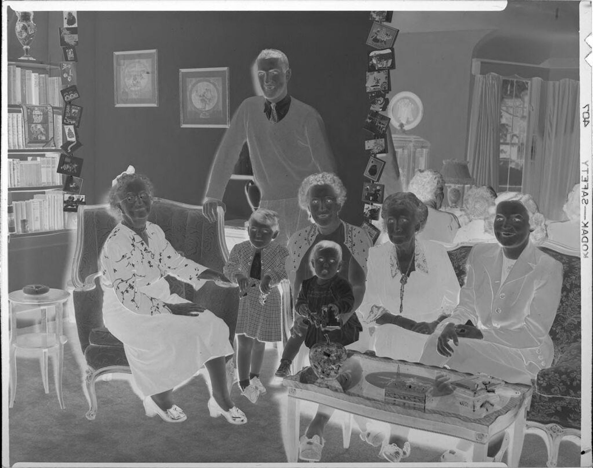 Untitled (family in living room) by John Howell