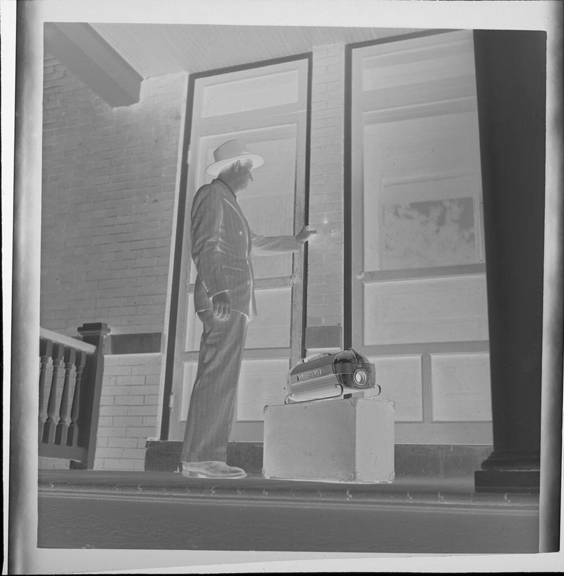 Untitled (door to door salesman ringing doorbell) by Jack Gould