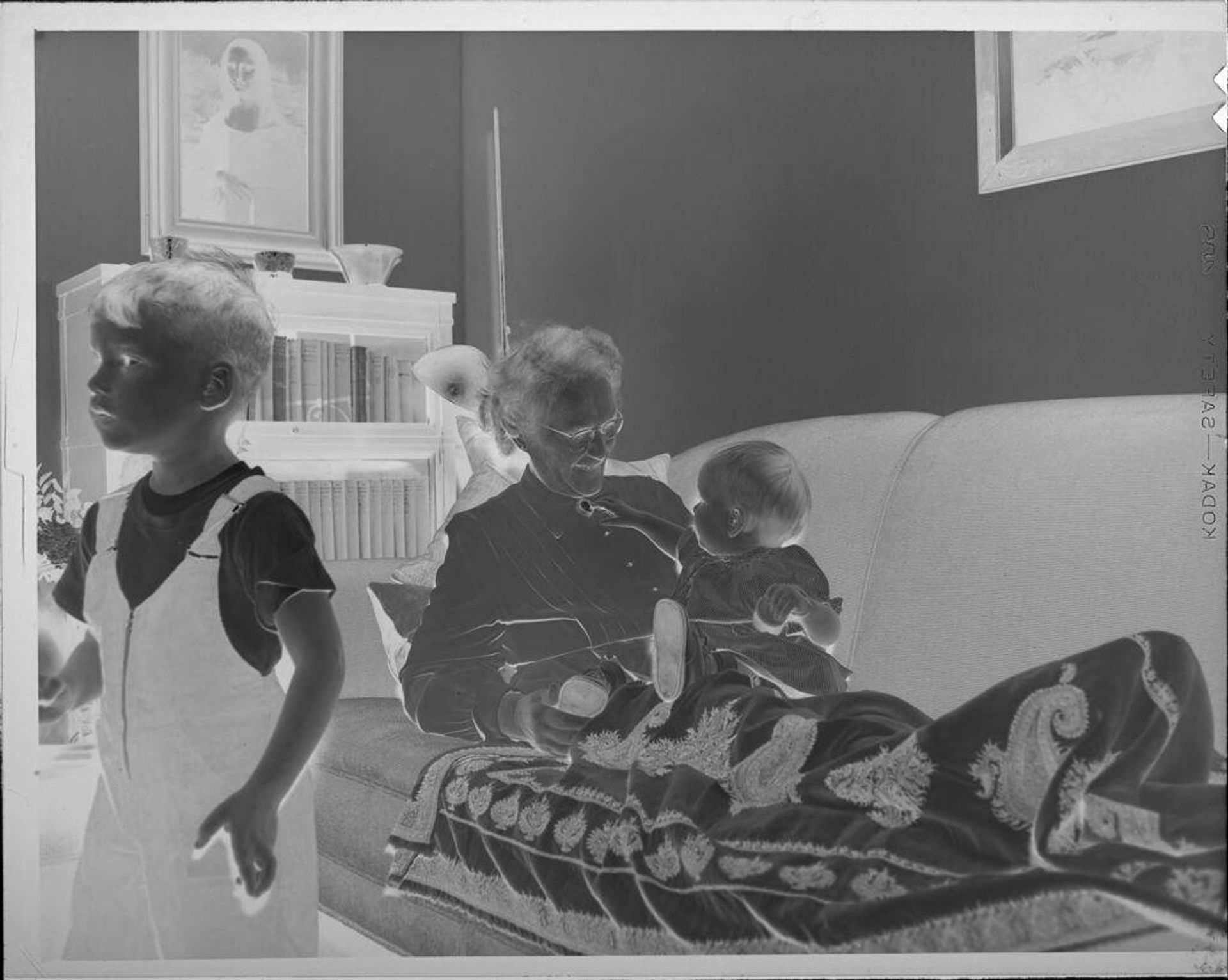 Untitled (children with grandmother on couch) by Lucian and Mary Brown