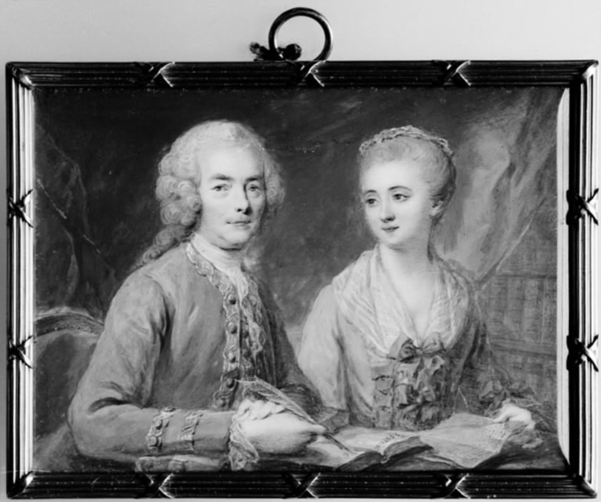 Twin Portrait of a Gentleman and a Lady Sitting at a Table by Cornelius Høyer