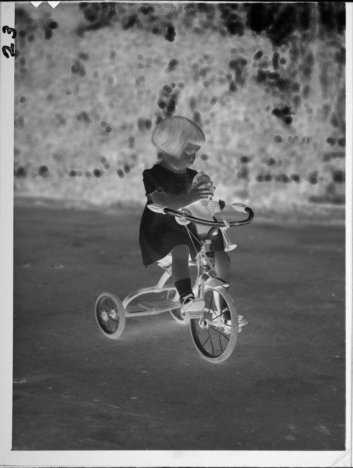 Untitled (little girl on tricycle) by Lucian and Mary Brown