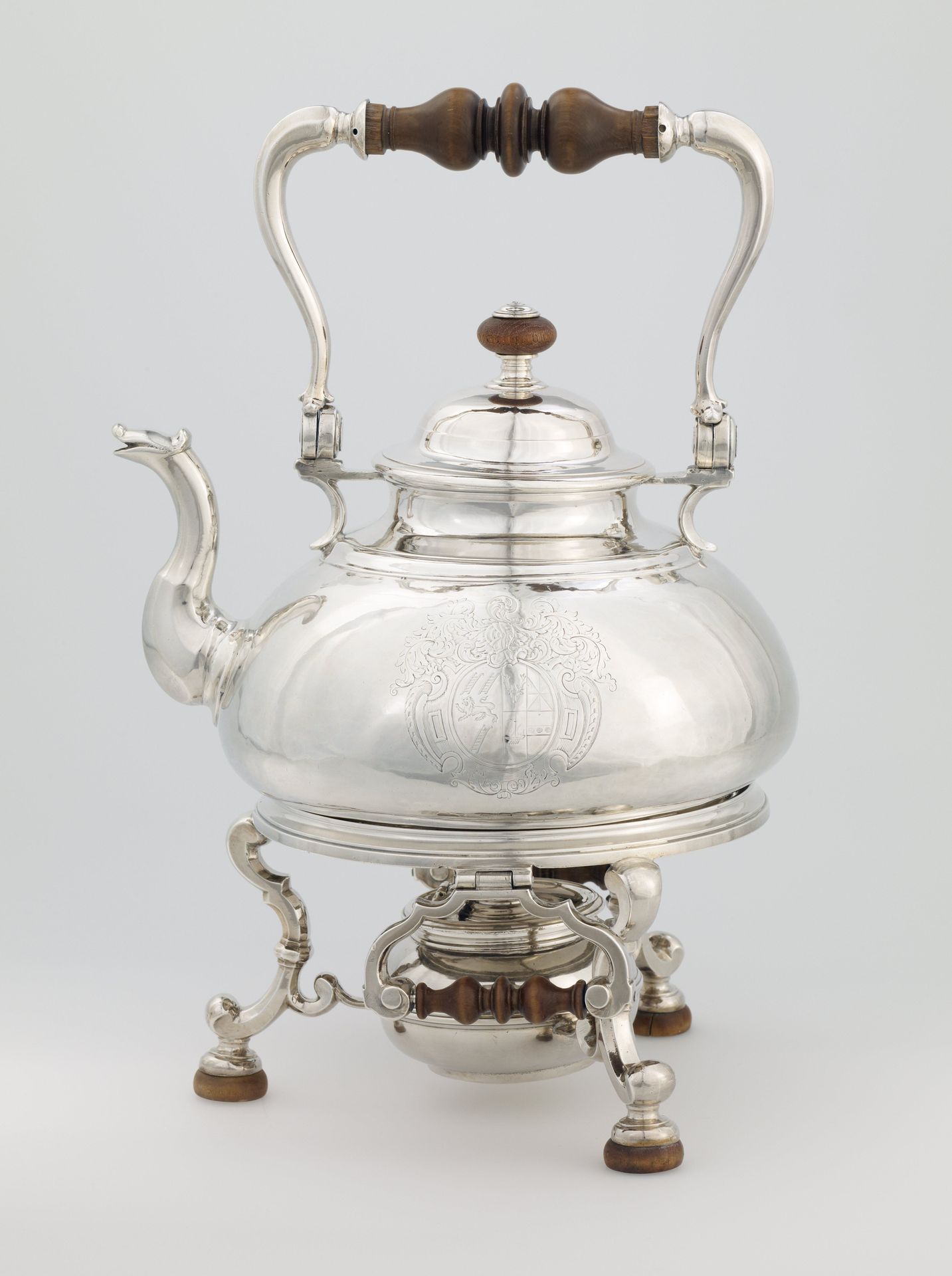 Tea kettle with warming stand by Edmund Pearce
