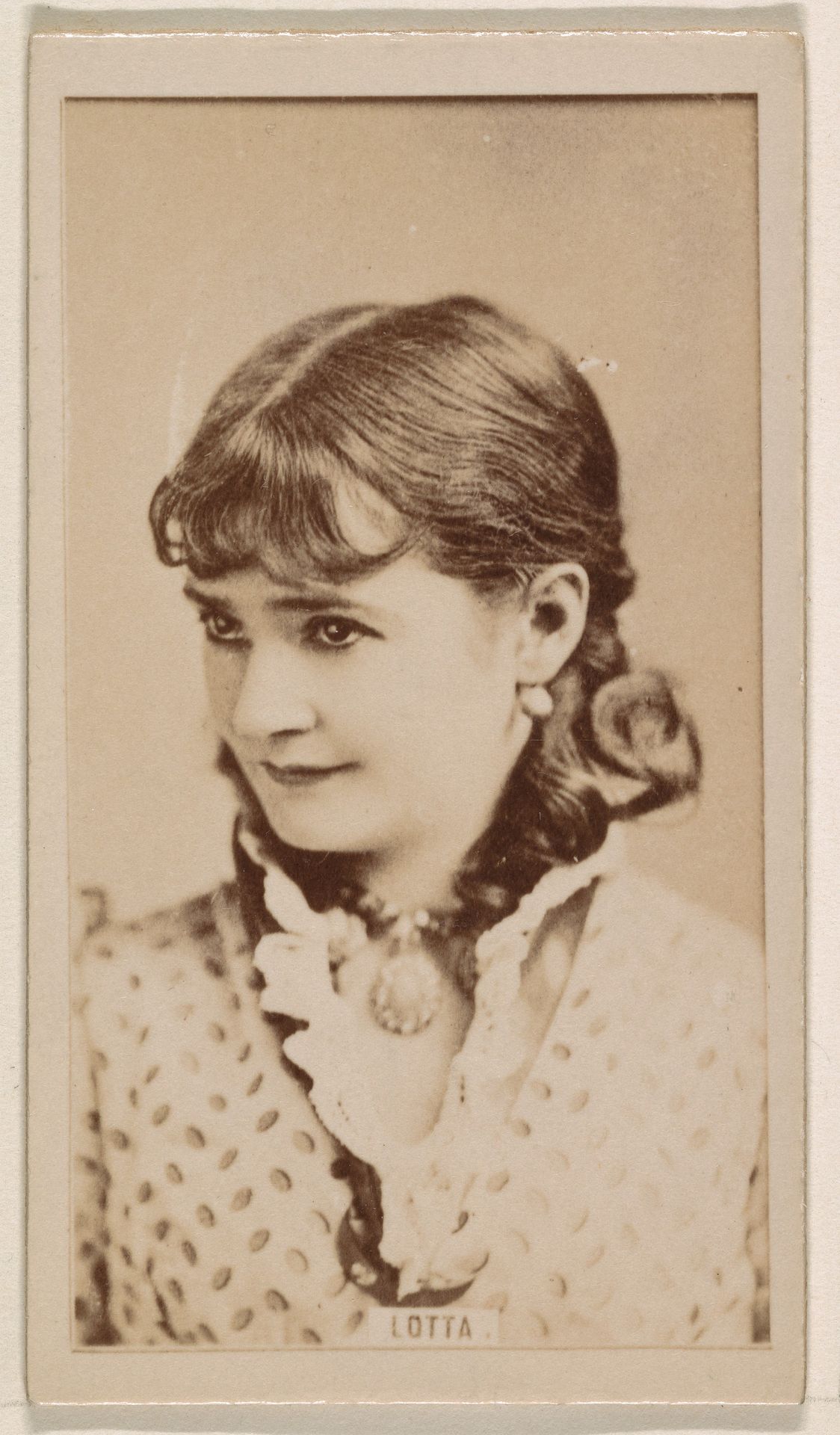 Lotta, from the Actresses series (N245) issued by Kinney Brothers to promote Sweet Caporal Cigarettes by Kinney Brothers Tobacco Company