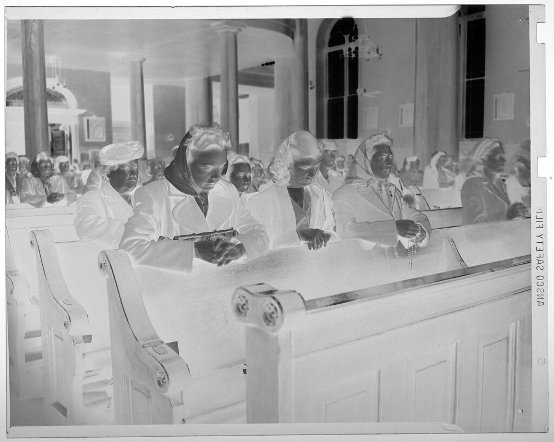 Untitled (VE Day: crowd of women praying in church) by Jack Gould